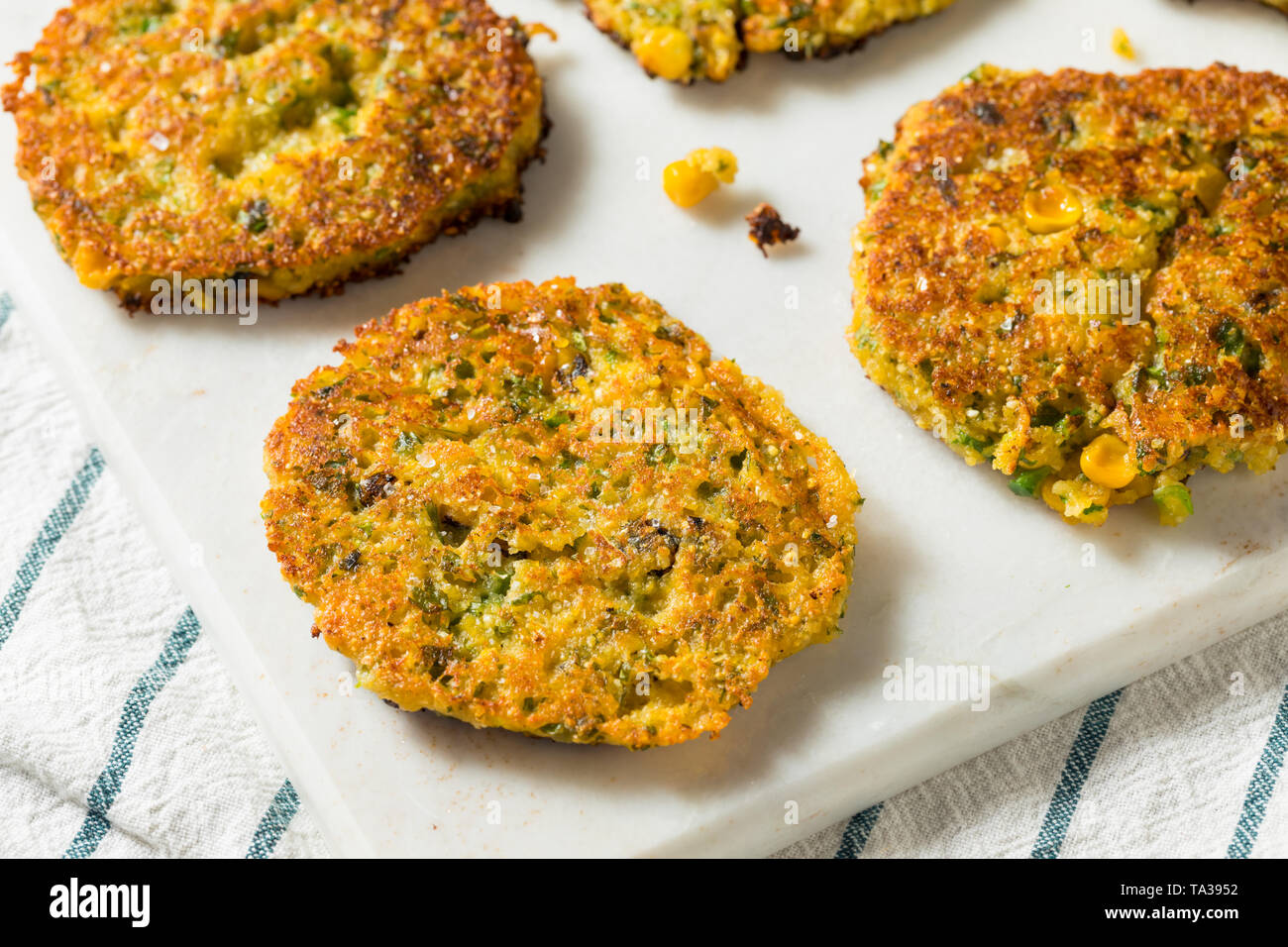 harina pan corn flour next to pan with arepa in it Stock Photo - Alamy