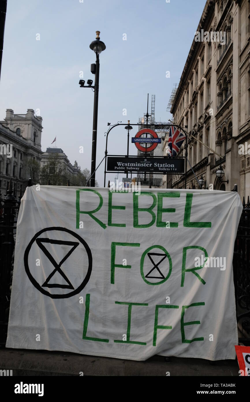 Rebel for Life protest banner hangs from Westminster tube station railings. Stock Photo
