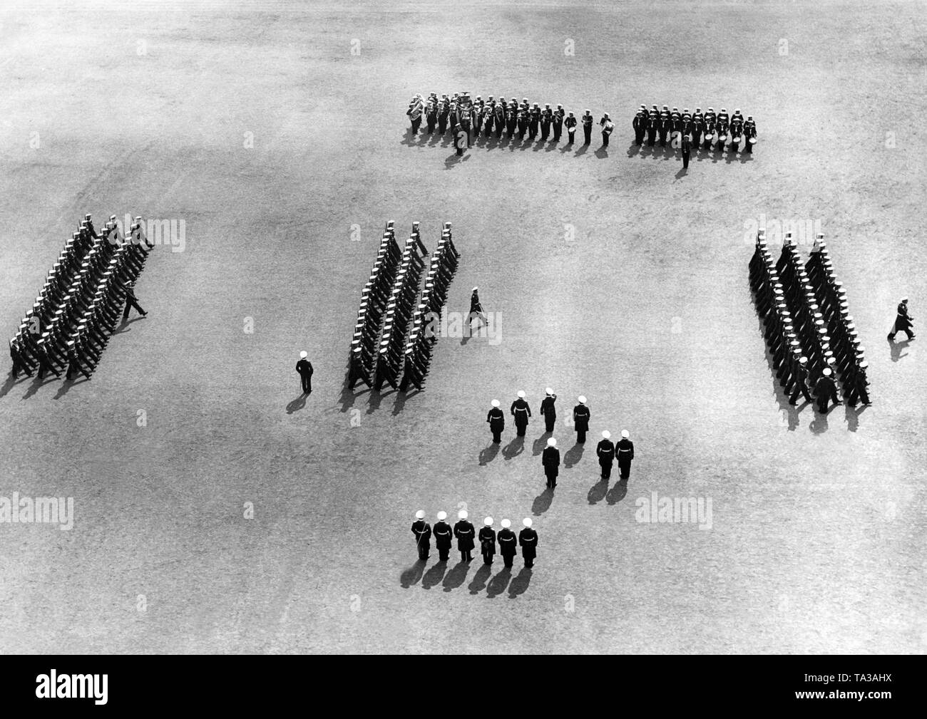 A view from the air on a parade of the Standortgruppe (location group) in Wilhelmshaven in front of Erich Raeder, the Commander-in-Chief of the Kriegsmarine. Stock Photo