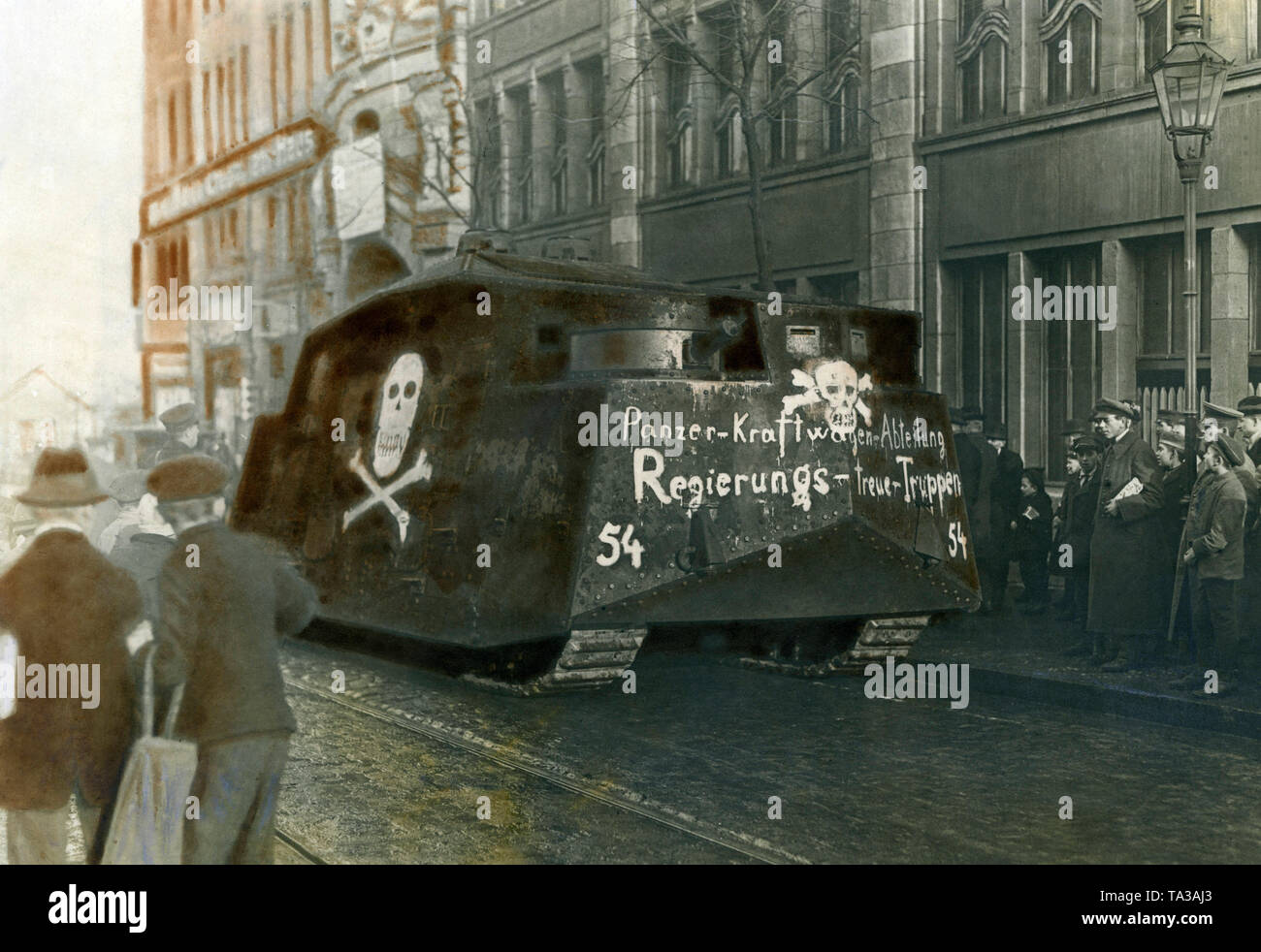 Freikorps units, commissioned by the Ebert government, suppressed the demonstrations and revolt of workers during the January uprising with artillery and tanks. Here, the A7V tank called 'Hedi' driving through a street in Berlin. Stock Photo