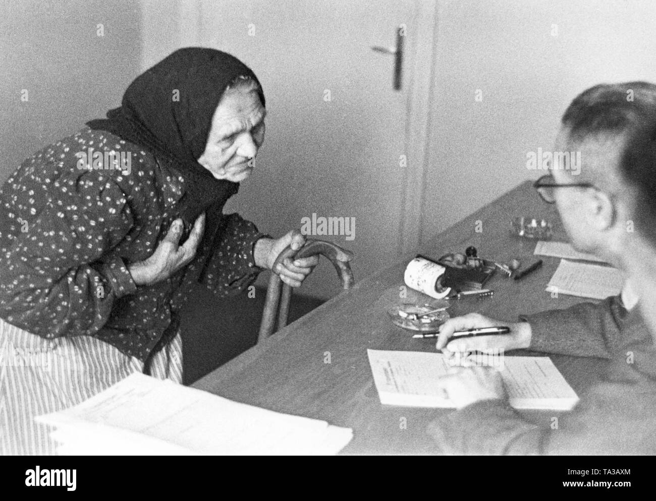 An old woman in the Reichsgau Danzig-West Prussia is enrolled in the Deutsche Volksliste (German People's List). This registration granted people German citizenship. Prior to this was checked the descent of the people and their political views before the invasion of Germany in Poland. The so-called  'Bekenntnisdeutsche', who were politically supporting the 'German Volkstum', could also get on the  Deutsche Volksliste. This was a common practice of the National Socialists also in the Reichskommissariat Ukraine and in Northern France . Stock Photo