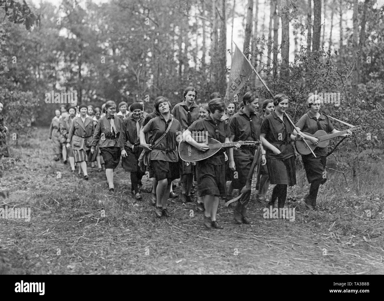 March of the 'Deutsche Jungmaedchendienst' to a medical practice. Stock Photo