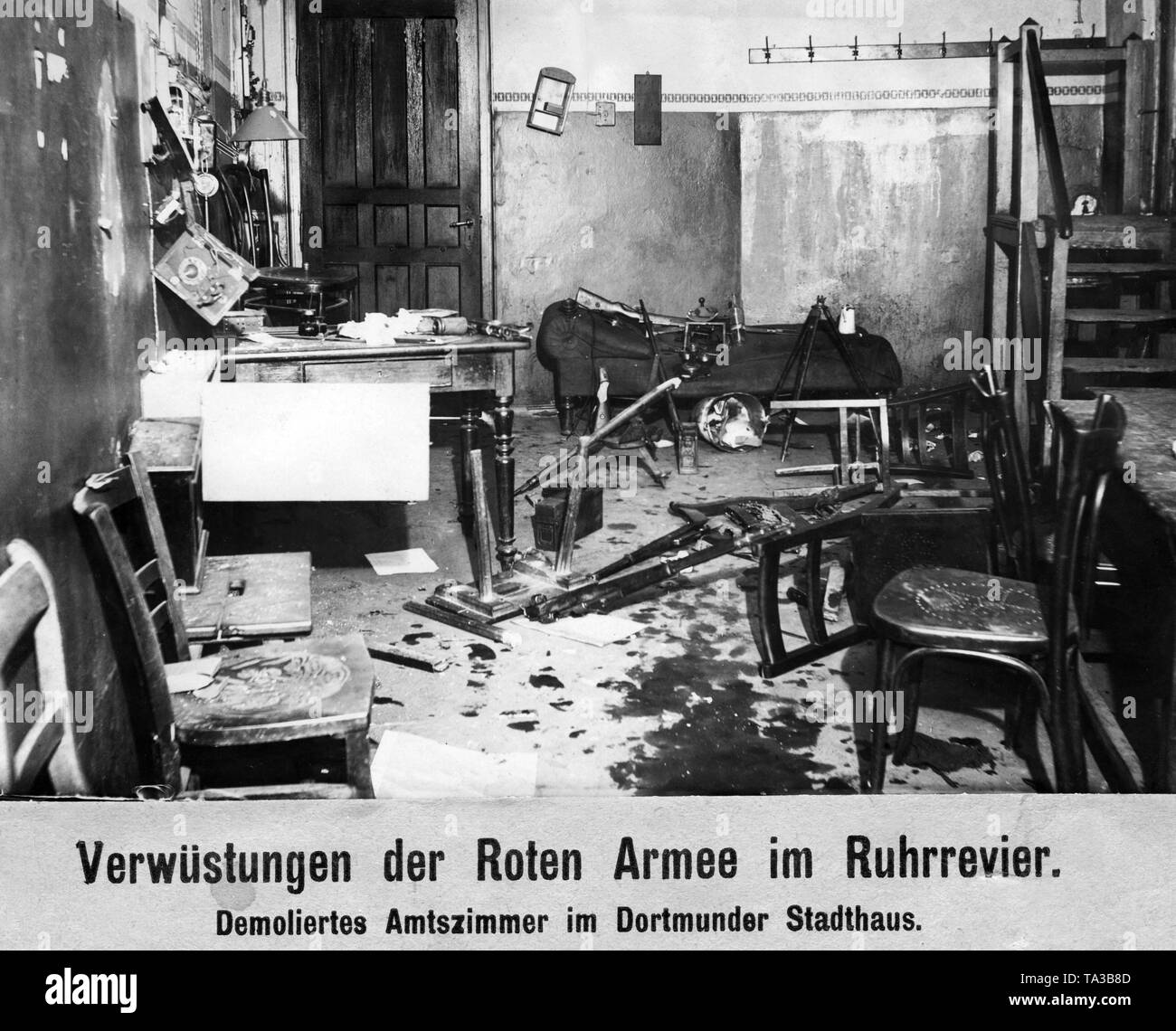 Two days after the beginning of the Kapp Putsch, a Communist uprising broke out in the Ruhr area. Armed workers take over the power in the Ruhr area. The Freikorps, which intervened on the government's order, is repulsed and suffers heavy losses. It was first on the 2nd of April, when the Reichswehr intervened, when the Red Army had to withdraw. After bloody battles the Reichswehr managed to restore the old order by the 10th of May. This photograph shows one of the numerous office rooms in the Dortmund Town Hall, devastated during the withdrawal of the Red Army. Stock Photo
