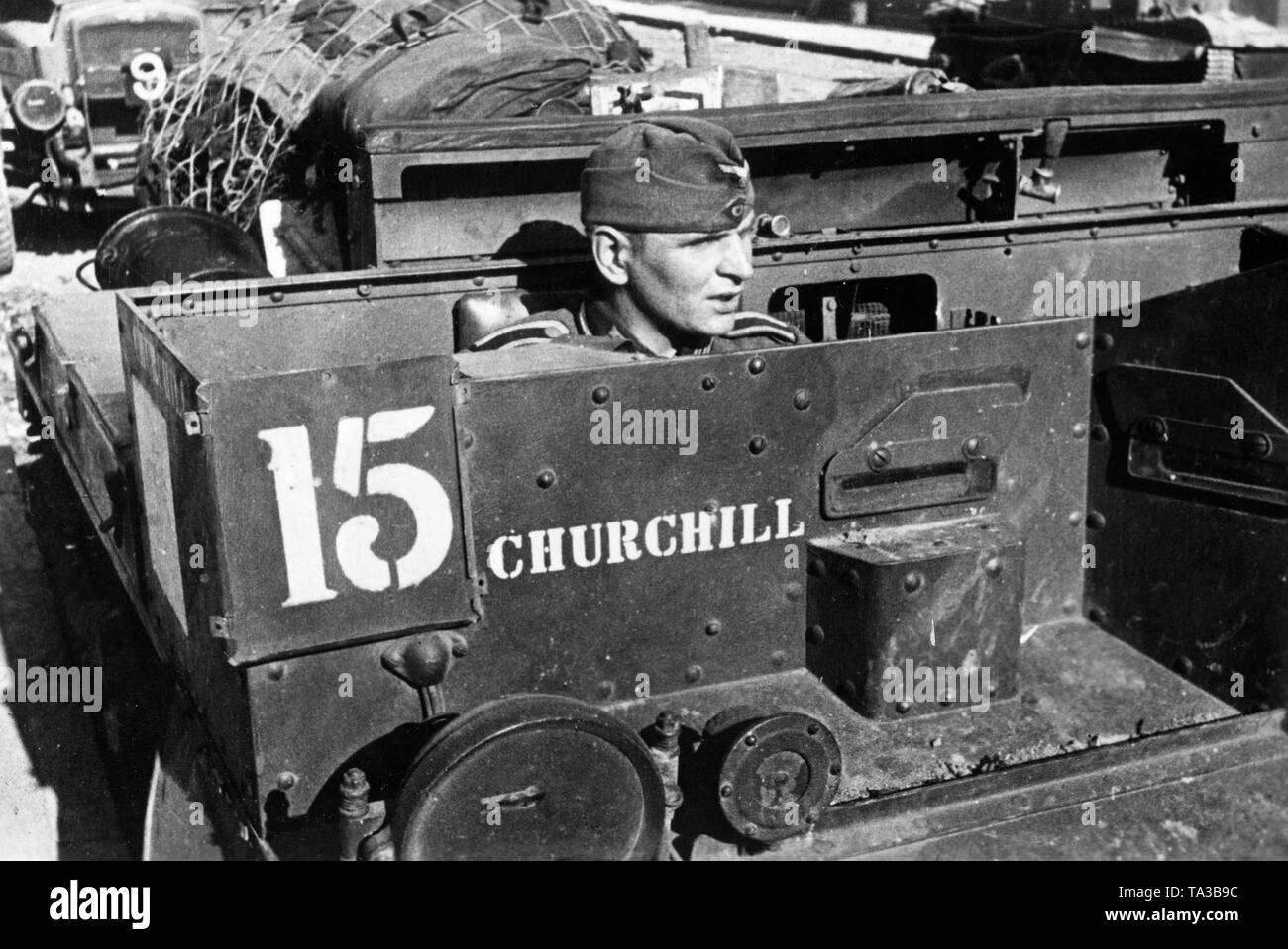 An Air Force soldier in a British Bren Carrier 'Churchill' on the beach of La Panne near Dunkirk. Photo: Pfitzner. Stock Photo