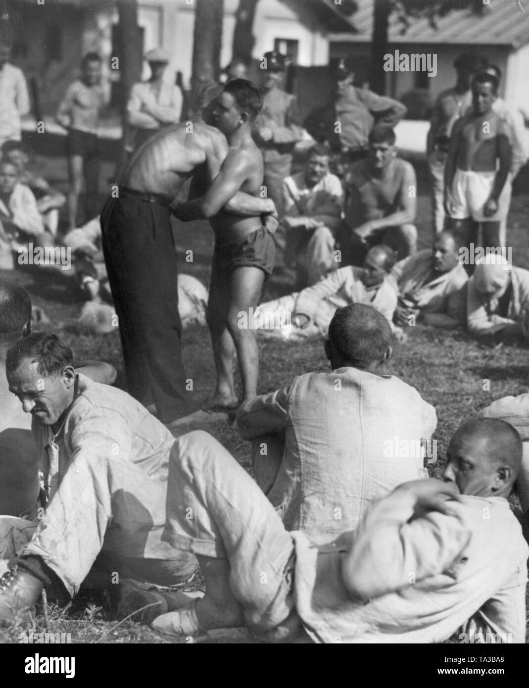 Prisoners of the Dachau concentration camp doing sport. Stock Photo