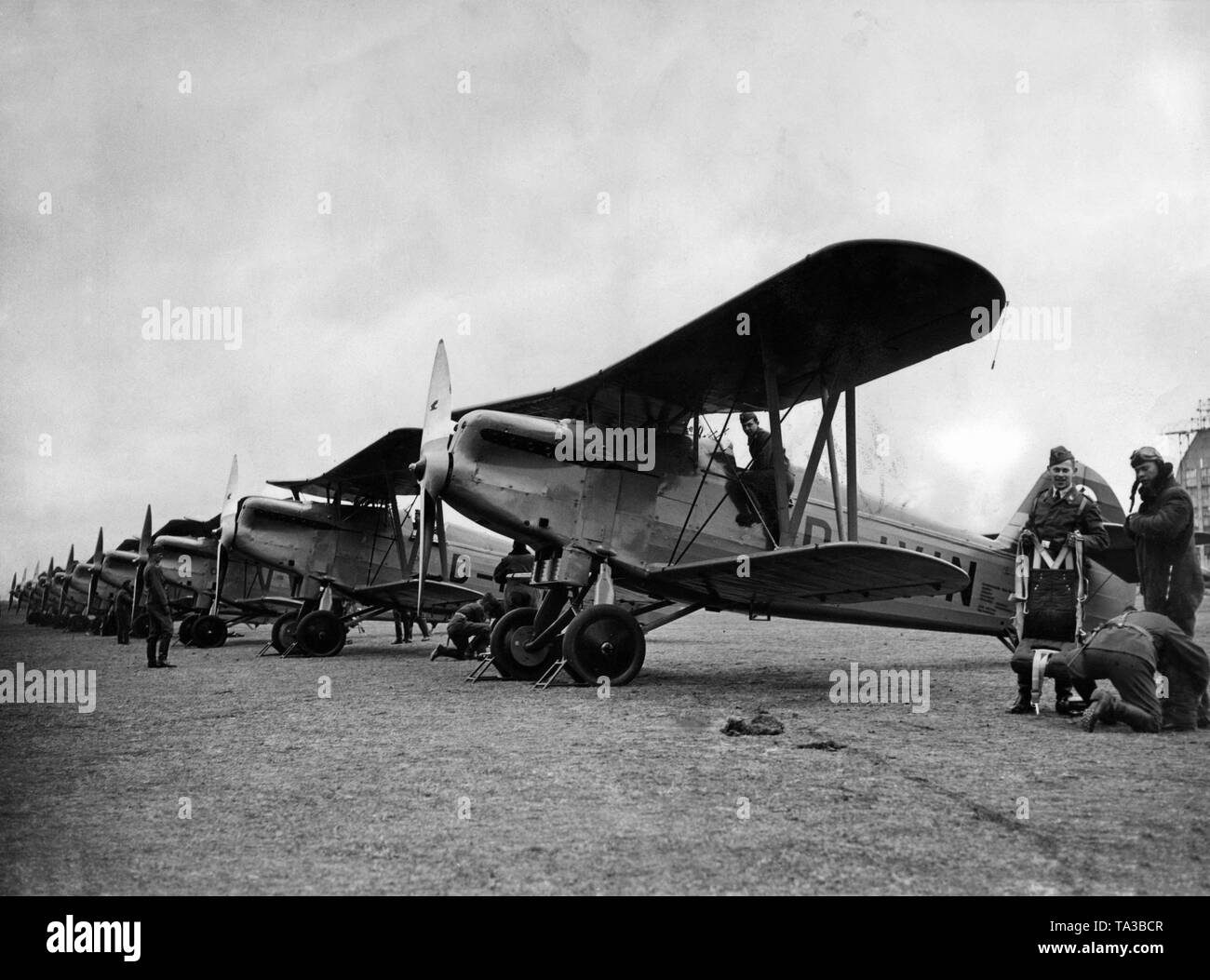 The picture shows fighter aircrafts of the German Luftwaffe at an airport, these are aircrafts of the type Arado Ar 65, a biplane was designed as a fighter aircraft. The series models were introduced on a large scale to the Luftwaffe (founded in 1935) of the Wehrmacht. Stock Photo