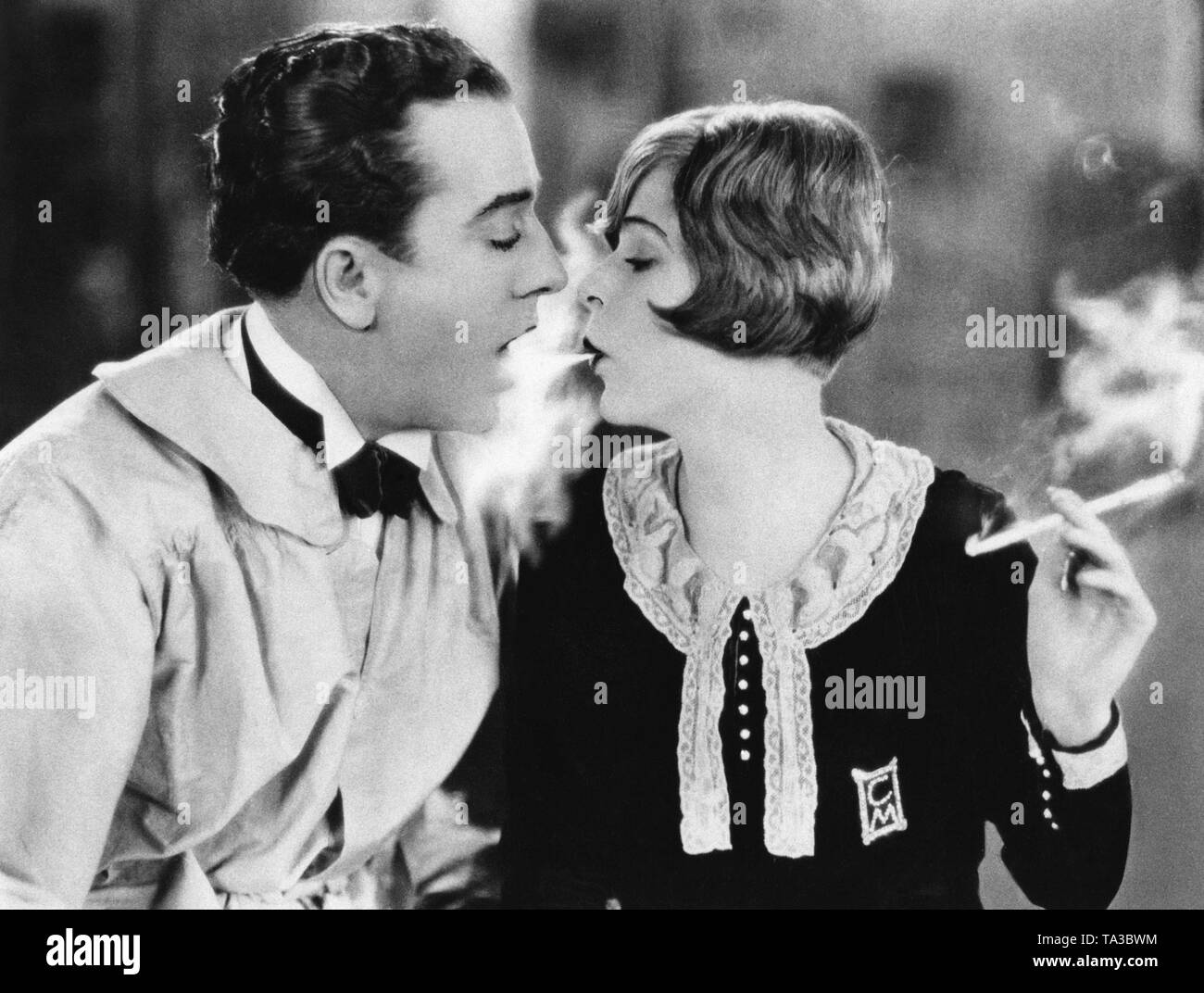 The American actors Jack Mulhall and Blanche Sweet together in a movie scene. Sweet has a 1920s style hairdo, the bob cut. Stock Photo