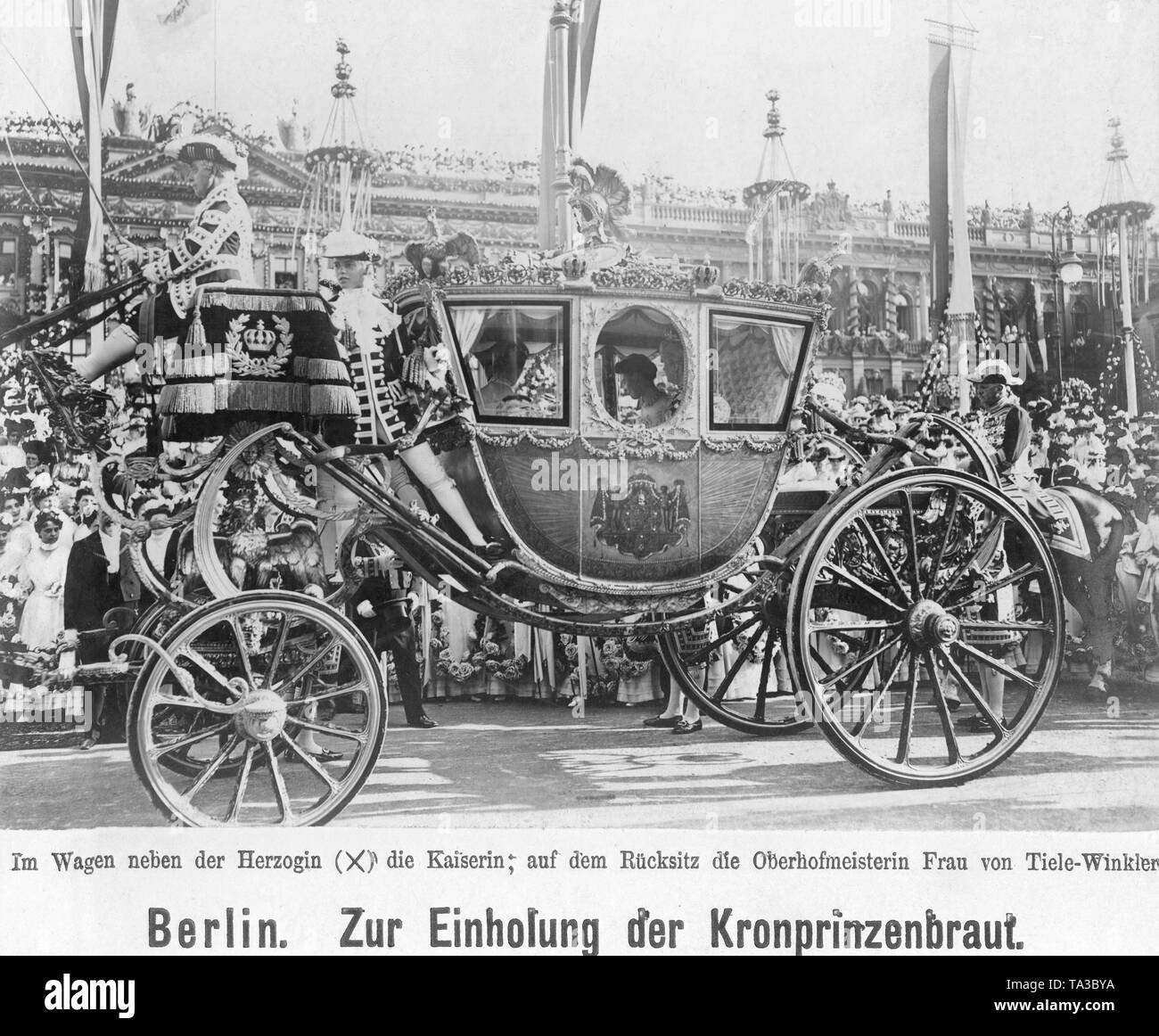 Crown Princess Cecilie (right behind) drives through Berlin together with her mother-in-law (right front), Empress Auguste Viktoria of Prussia, and the Mistress of the Robes Ms von Tiele-Winkler (left). Here she listens the speech of the Berlin Mayor Kirschner on the Pariser Platz from the carriage. Stock Photo