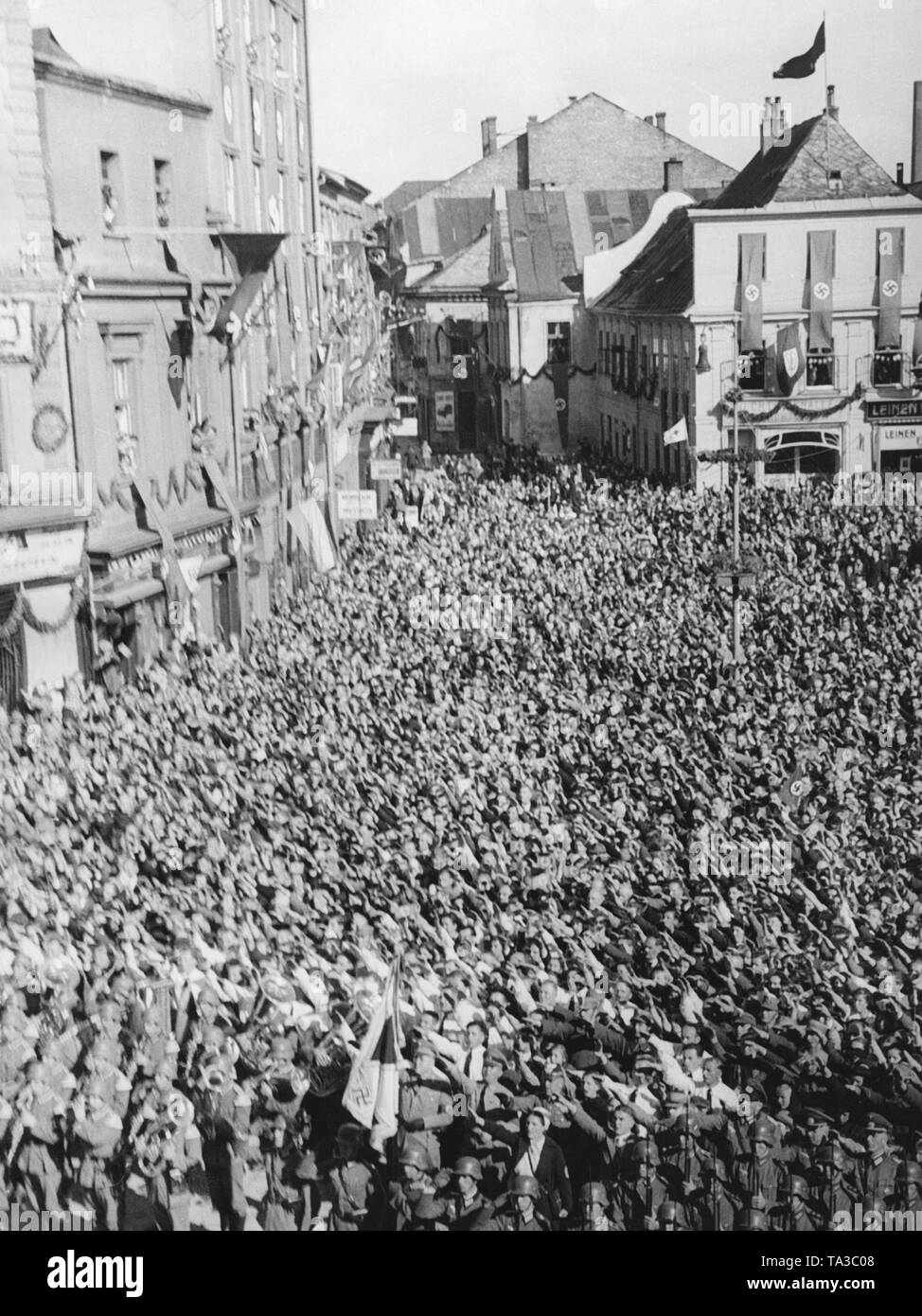 View of the townhall square of Jaegerndorf (today Krnov) on October 7, 1938, while Adolf Hitler is giving a speech during the occupation of the Sudetenland. Stock Photo