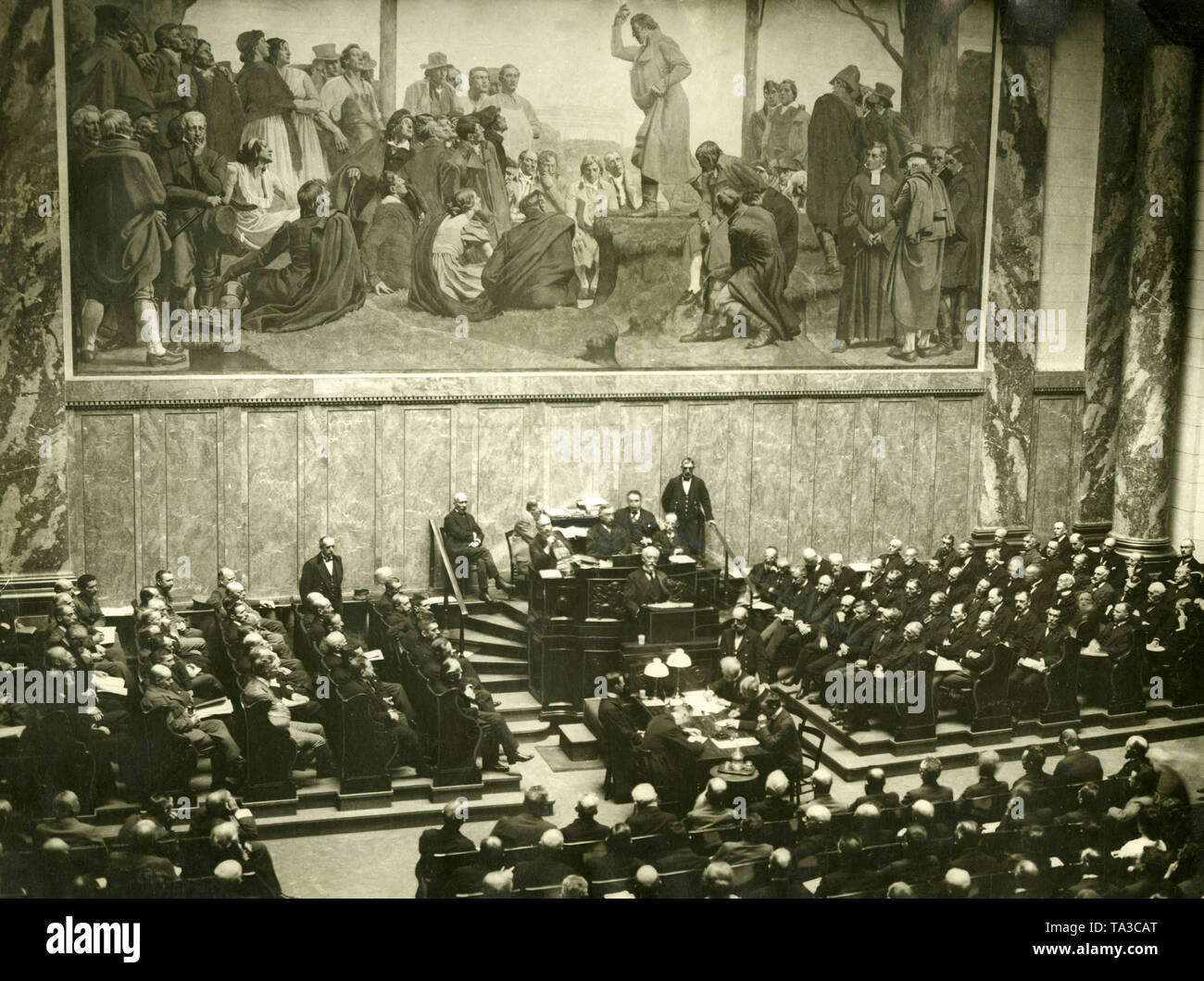 Prime Minister Philipp Heinrich Scheidemann speaks before the National Assembly against the adoption of the Versailles Treaty at a protest meeting in the auditorium of the Berlin National Library. The dispute over the adoption has caused the government to break in two. This dispute lasts until 1933. Stock Photo