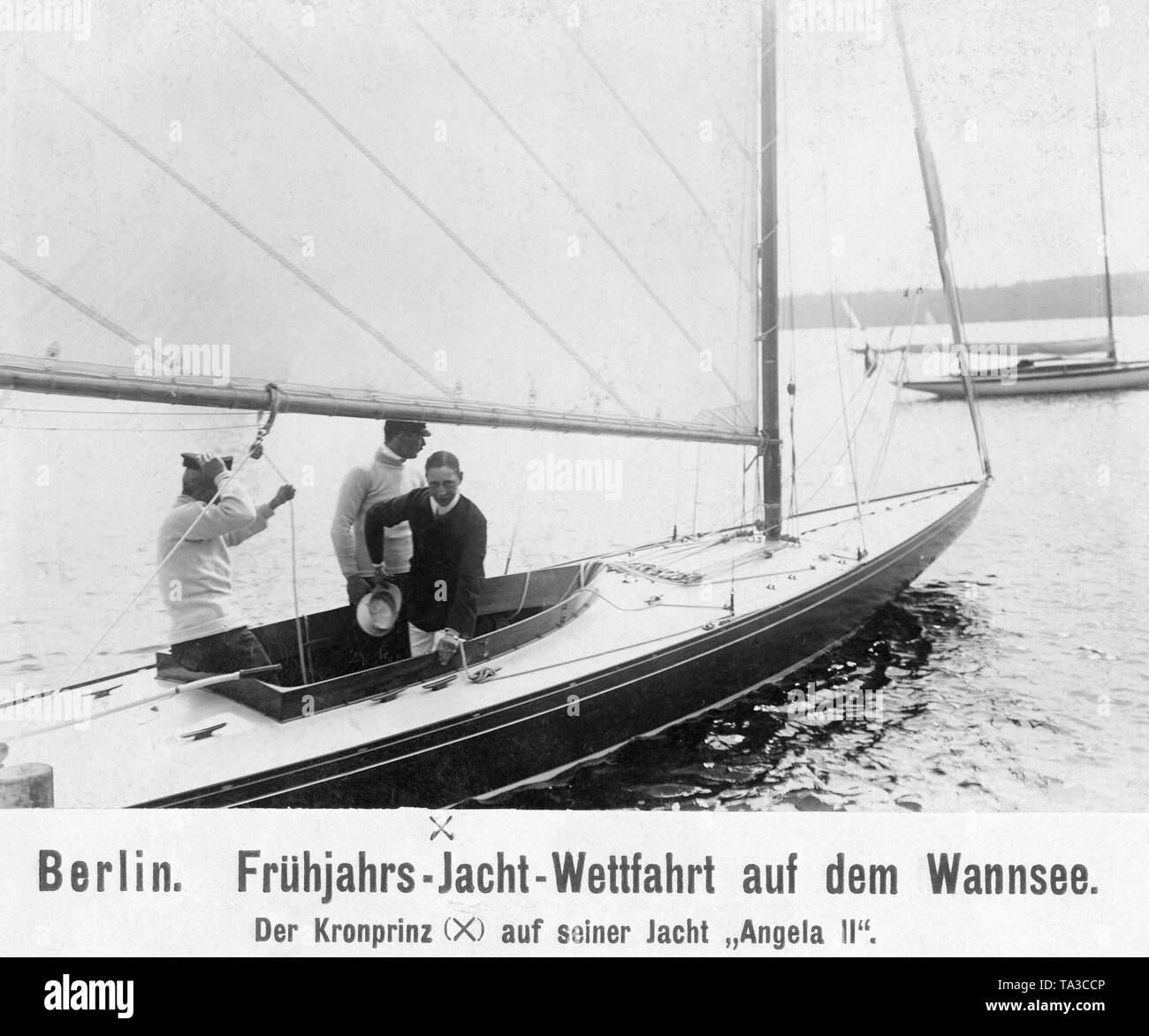 Crown Prince Wilhelm (right) during a spring yacht race on his 'Yacht Angela 2'. Stock Photo