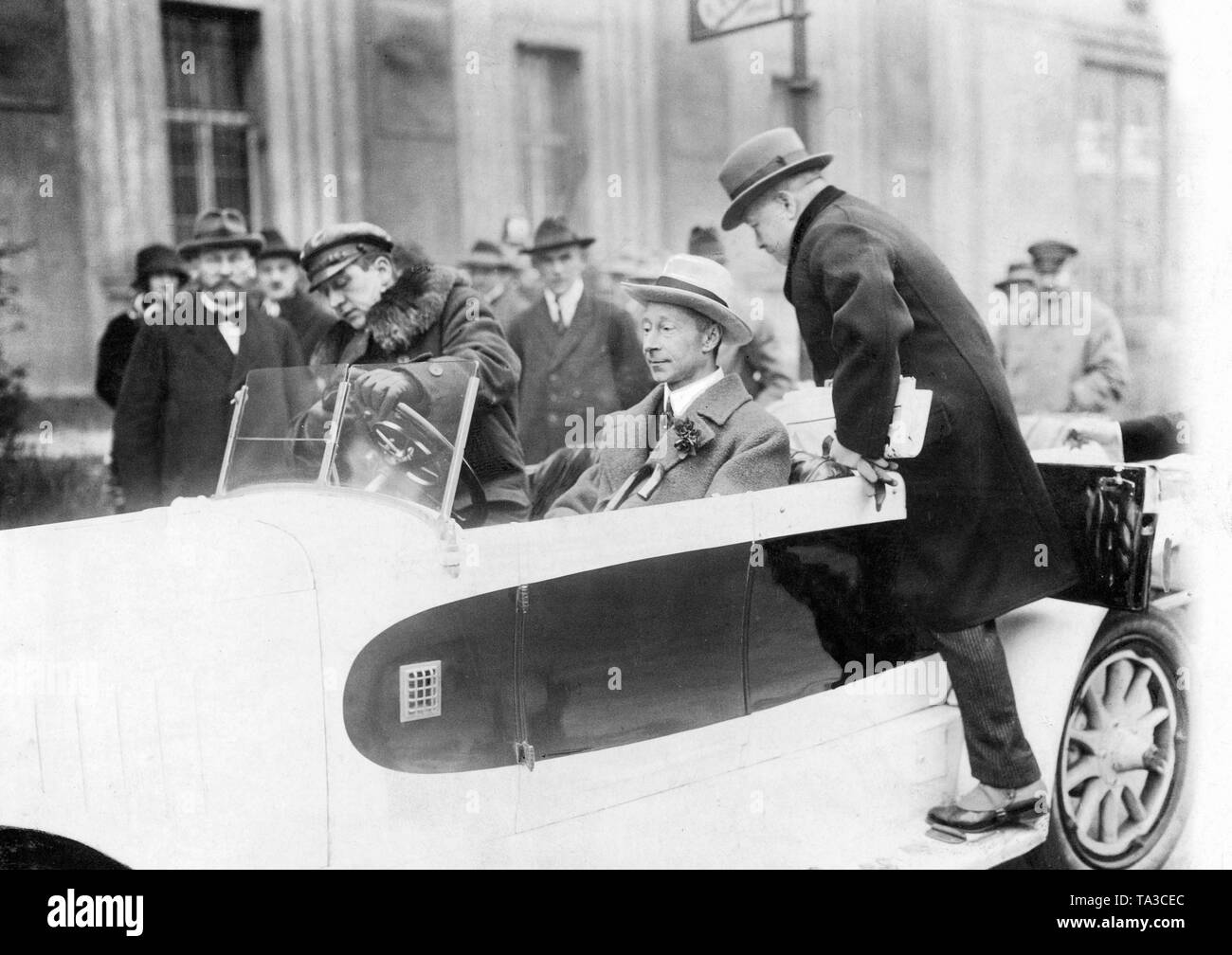 Crown Prince Wilhelm (4th from left) shortly before the test drive of his new car. Stock Photo