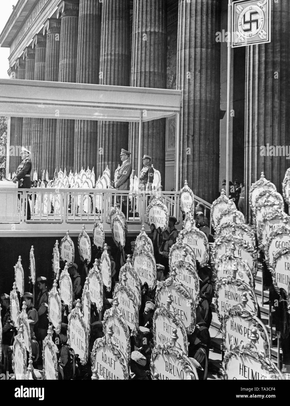 Hermann Goering during a speech under a canopy with swastika during the state ceremony of the Condor Legion in the Lustgarten on the Museum Island on June 6th, 1939. Behind him, Adolf Hitler. On the right and left side of the lectern, members of the Hitler Youth are standing with nameplates of the fallen German fighters in the Spanish Civil War in front of the Altes Museum. Stock Photo