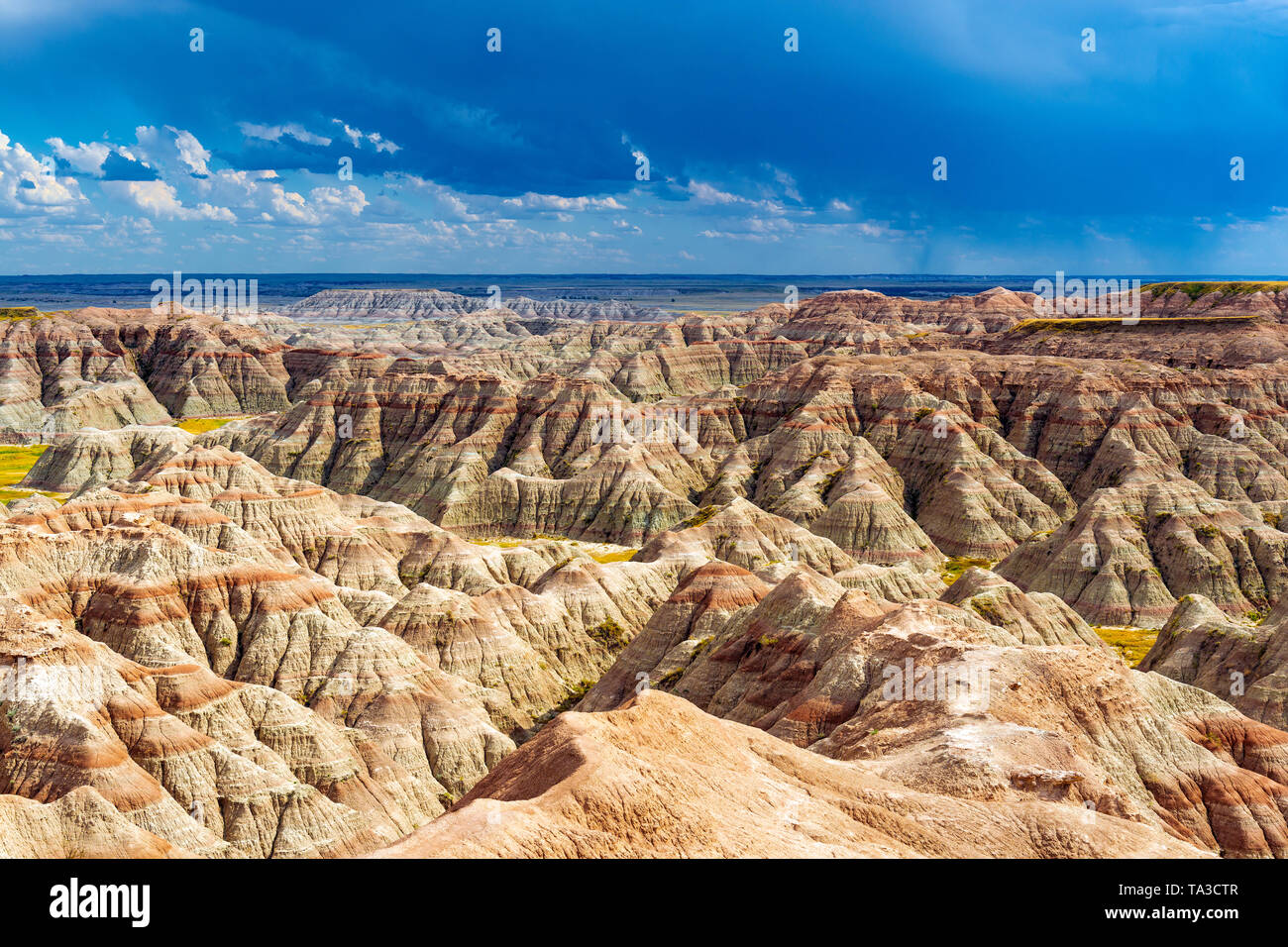 A thunderstorm inside Badlands national park with the rock formations illuminated by sunlight, Rapid City, South Dakota, USA. Stock Photo