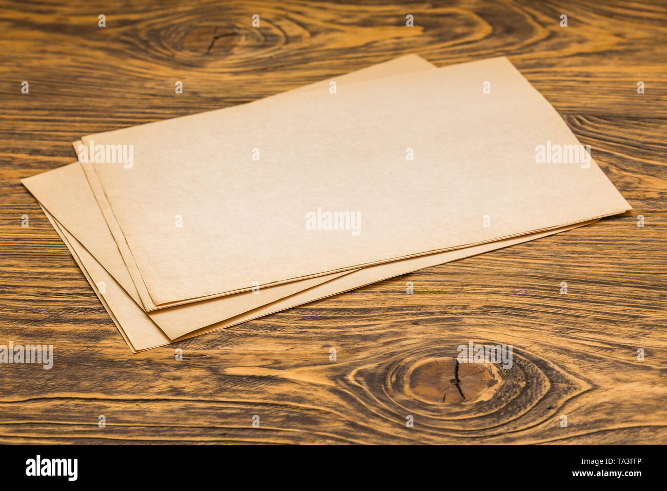 sheets of old paper on table Stock Photo