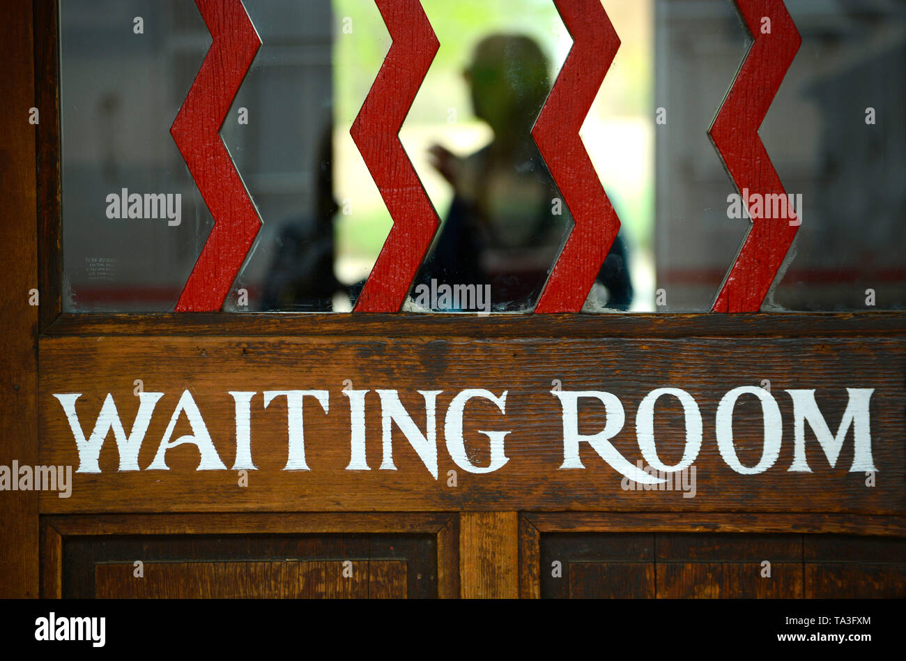An entrance door to the waiting room at the historic railroad depot in Lamy, New Mexico USA Stock Photo