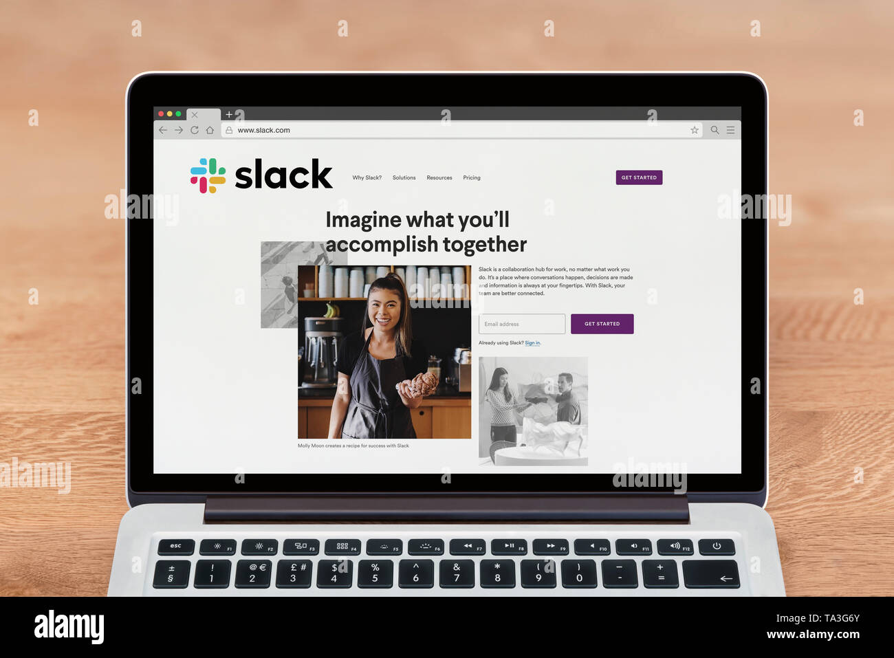 An Apple Macbook displays the Slack website (Editorial use only). Stock Photo