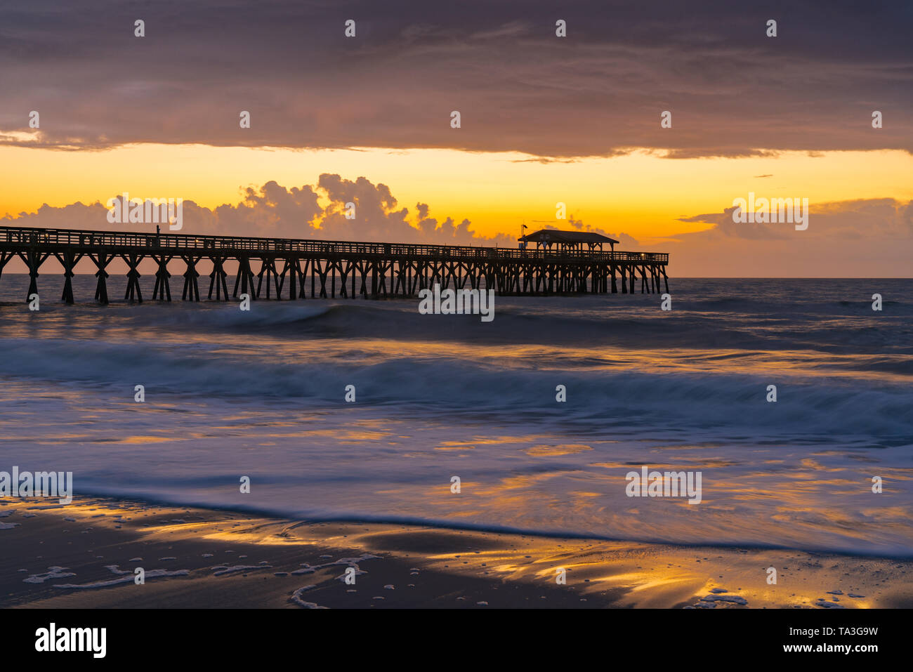 Morning sunrise along the ocean near pier in Myrtle Beach, South Carolina Stock Photo