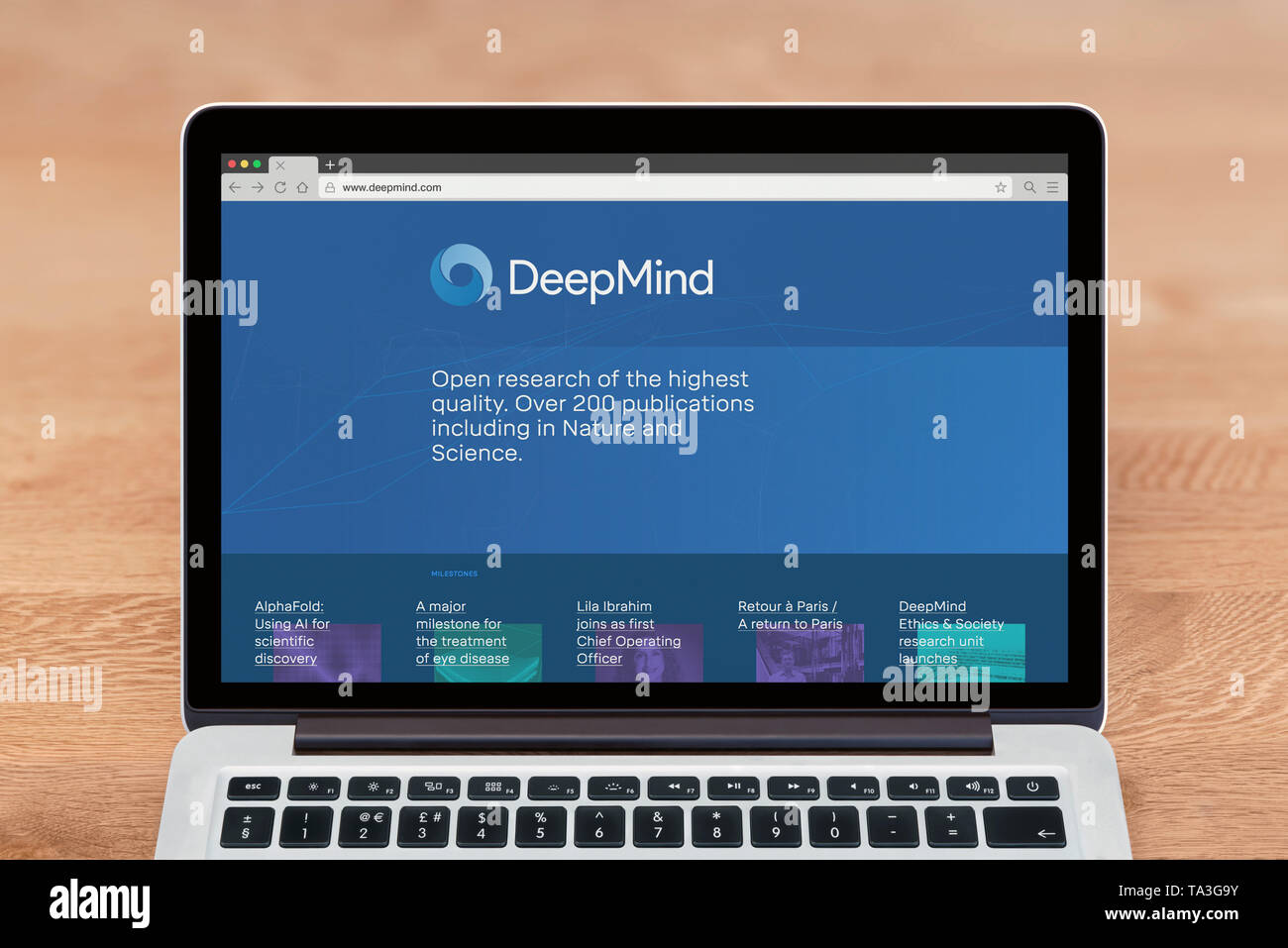 An Apple Macbook displays the Deepmind website (Editorial use only). Stock Photo