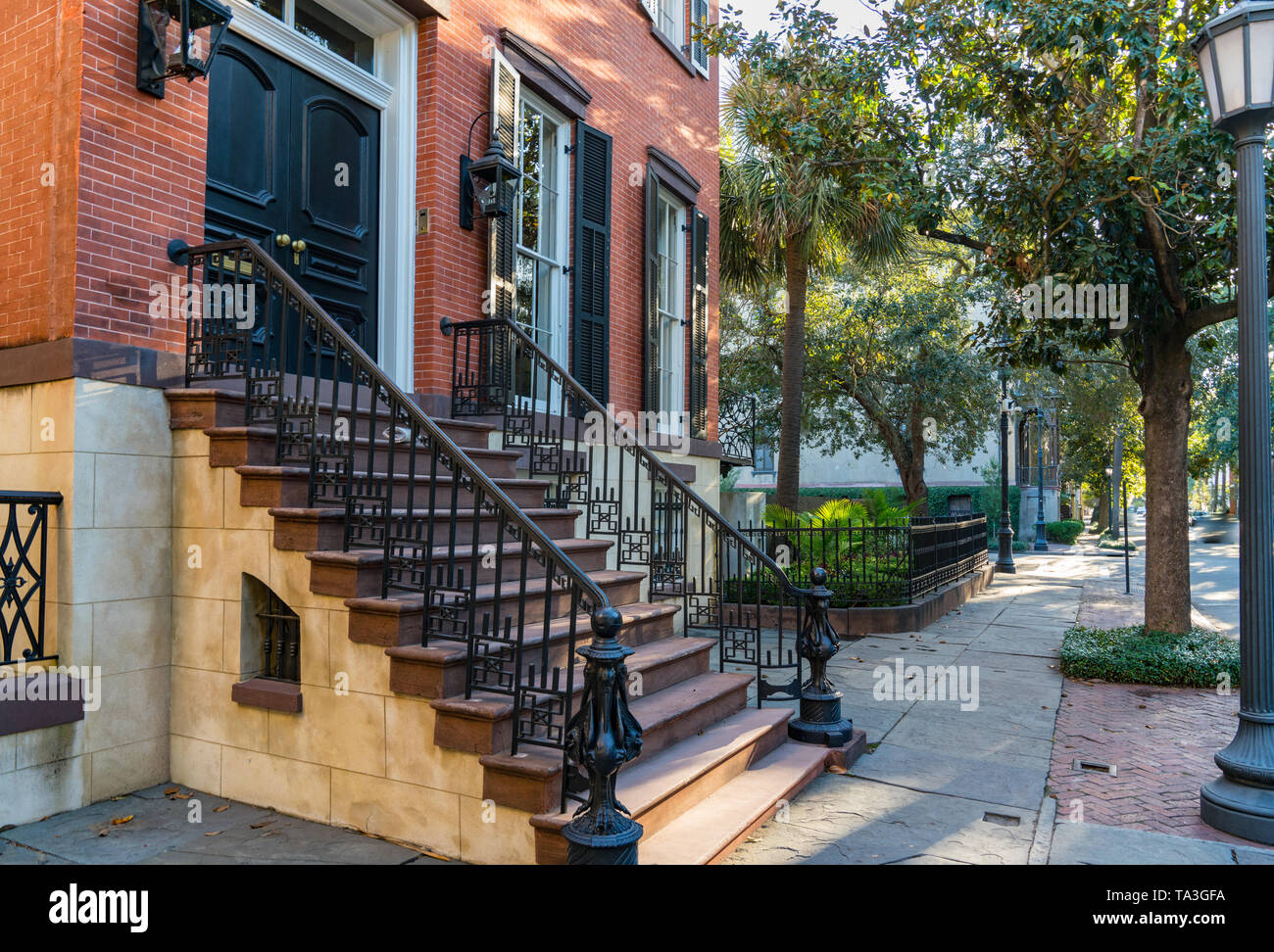 Historic home with wrought iron along the the street in Savannah, Georgia Stock Photo