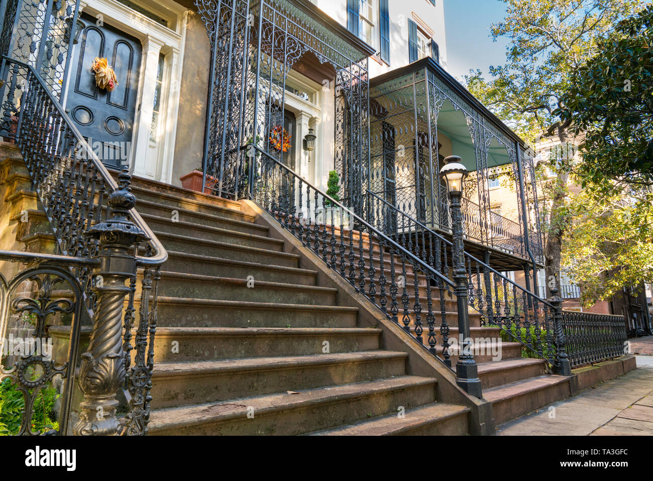 Historic homes with wrought iron along the the street in Savannah, Georgia Stock Photo