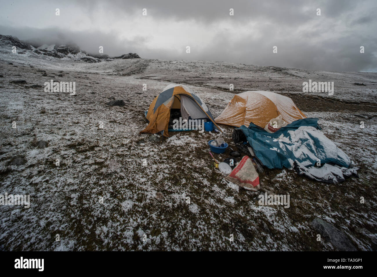Cold weather camping in the puna grassland high in the Andes mountains in Southern Peru. Stock Photo