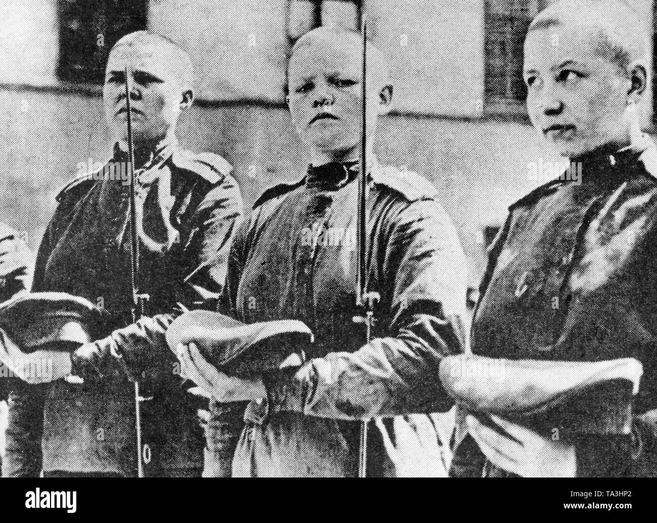 Three Russian female soldiers, who belonged to the unit that defended the Winter Palace from the onslaught of the Bolsheviks. Stock Photo