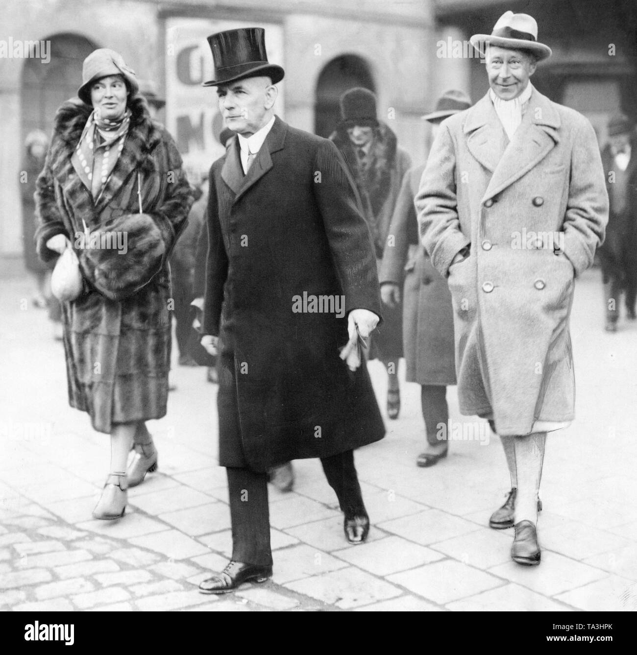 On the occasion of the 60th birthday of the former Emperor Wilhelm II his daughter-in-law, Crown Princess Cecilie von Mecklenburg (left), and his son, Crown Prince Wilhelm (right), travel to the imperial exile home in Doorn. Stock Photo