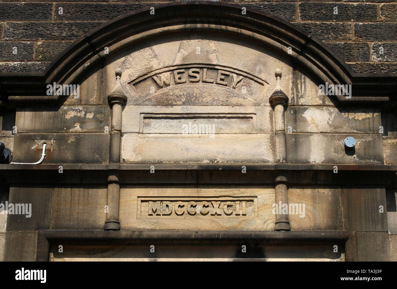 Roman Numerals Inscriptions Roman numerals and Wesley, inscriptions in stone above a doorway in ...