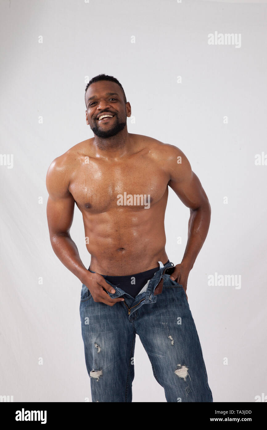 Happy strong Black Man with his shirt off Stock Photo - Alamy