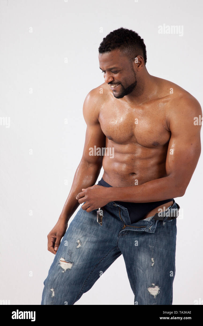 Happy strong Black Man with his shirt off Stock Photo - Alamy