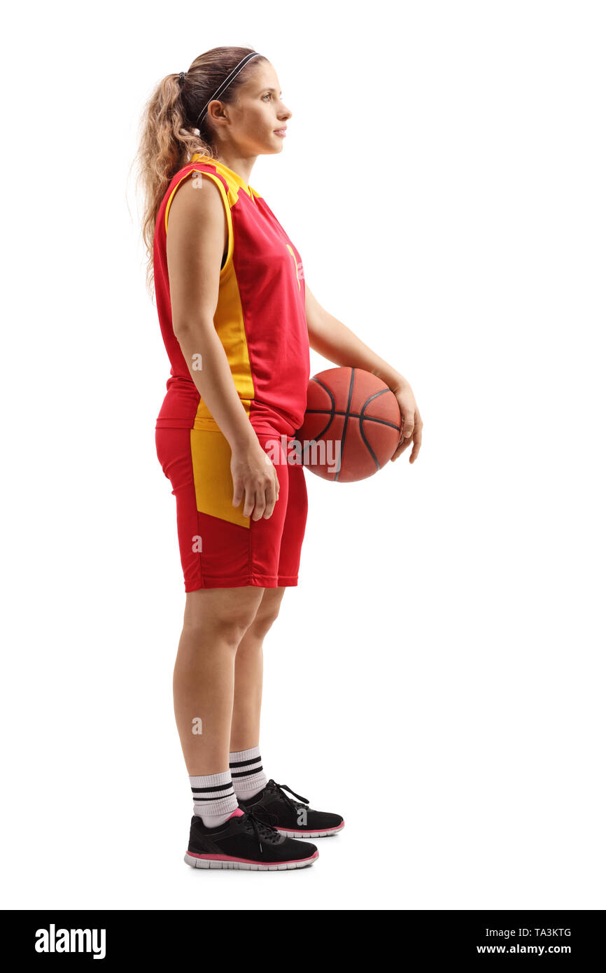 Full length profile shot of a female basketball player standing with a