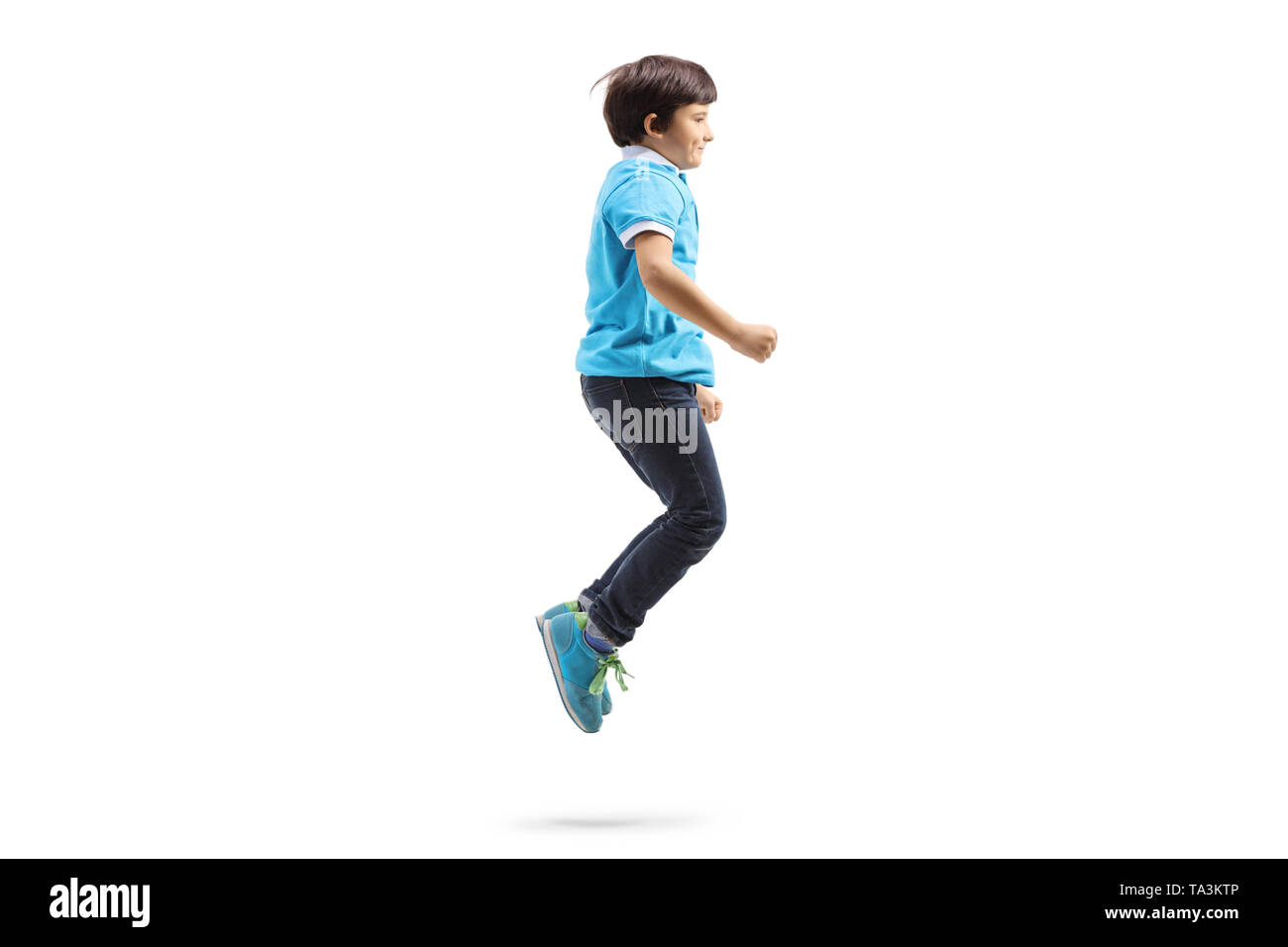 Full length profile shot of a happy boy jumping isolated on white background Stock Photo