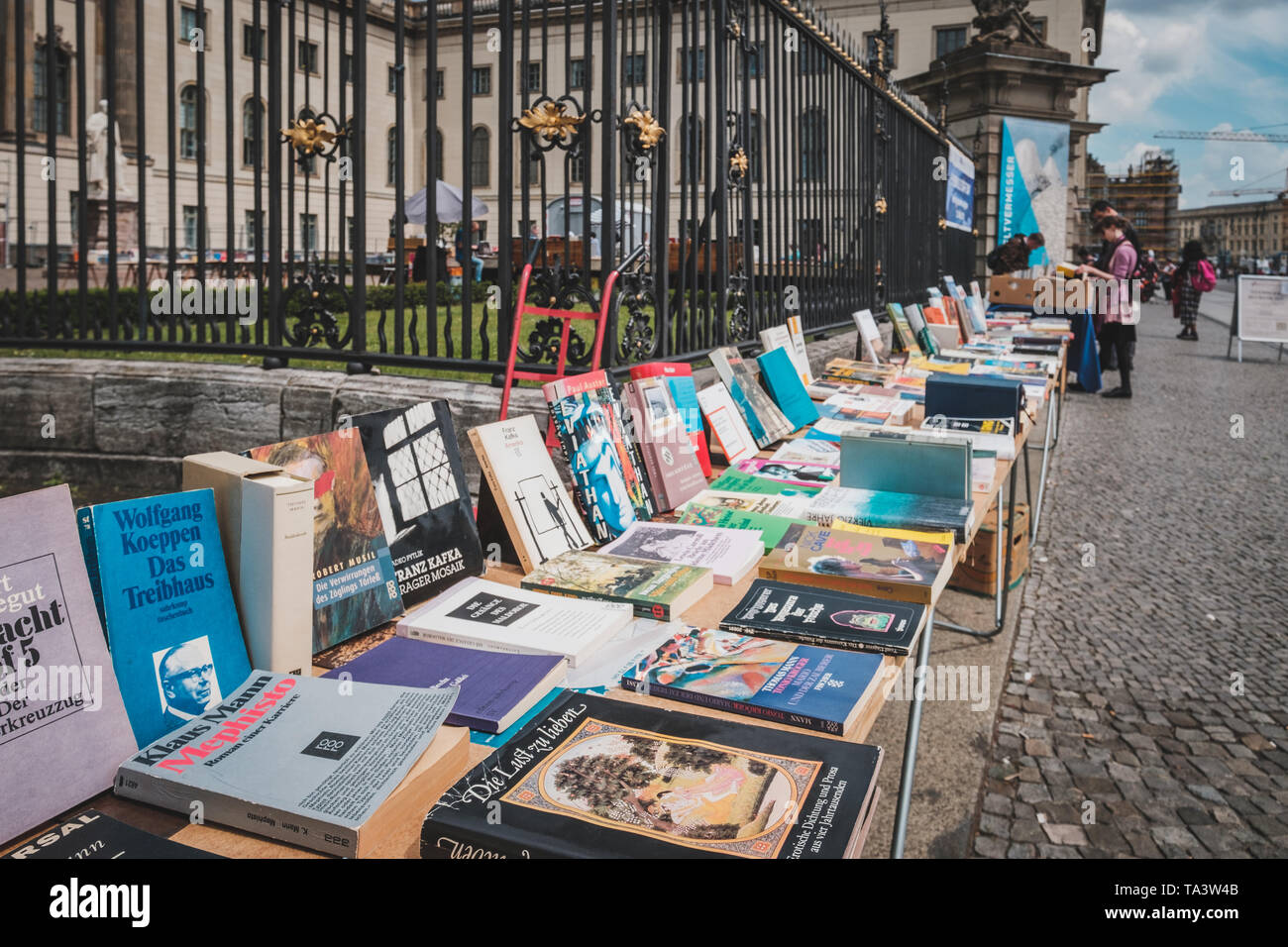 Berlin, Germany May, 2019 Table with old books, second hand book store on flea market in