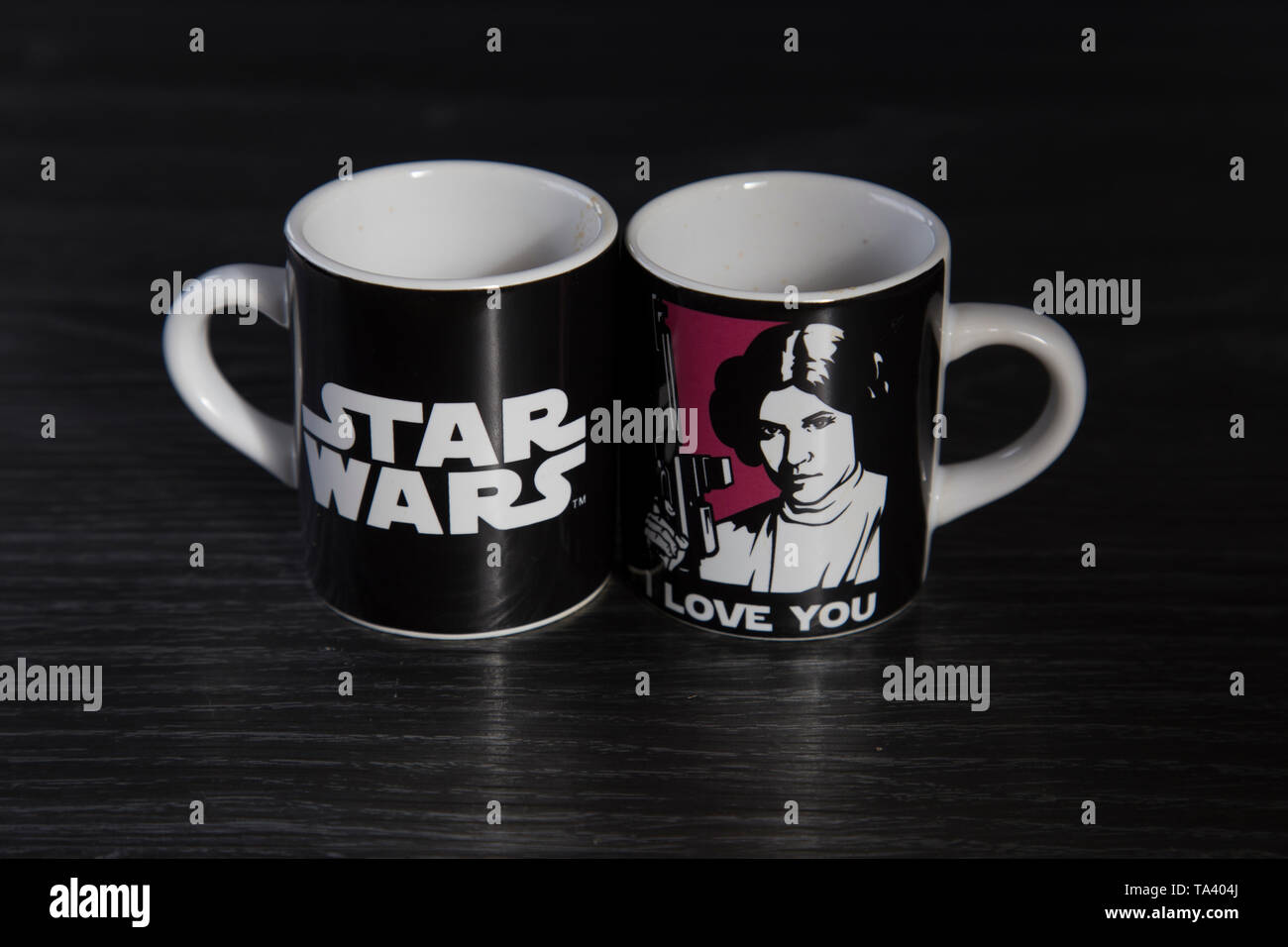 Two Star Wars branded espresso cups. One with Princess Leia saying I love  you and the other with Han Solo saying I know. On wooden bench top Stock  Photo - Alamy