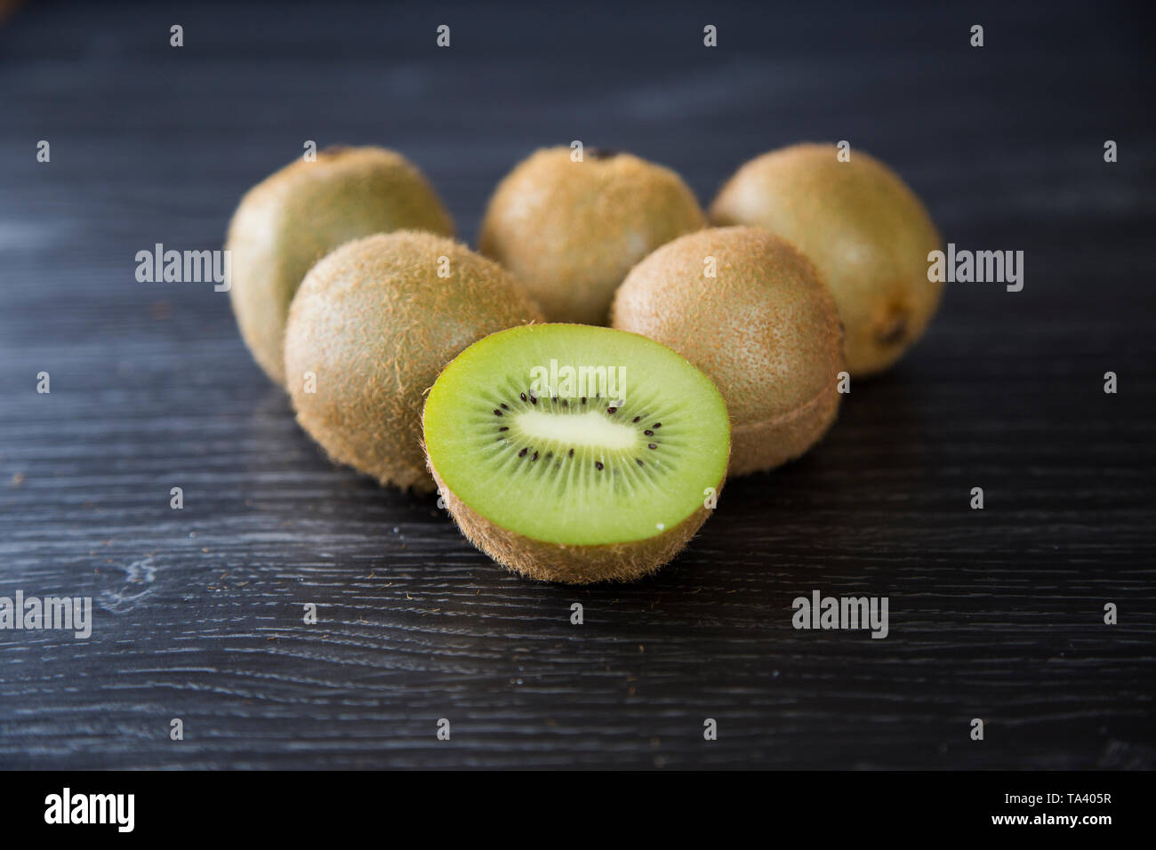 Pile of organic brown fuzzy kiwi fruit from New Zealand. The original