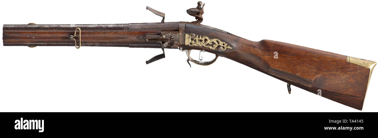 https://c8.alamy.com/comp/TA4145/a-german-turnover-flintlock-rifle-circa-1780-vertical-barrels-octagonal-breech-section-then-round-after-cut-girdles-smooth-bore-in-14-mm-with-brass-front-sight-smooth-flintlock-in-the-trigger-guard-lever-for-the-unlocking-of-the-turnover-mechanism-carved-two-piece-walnut-stock-with-smooth-brass-furniture-the-side-plate-decorated-with-openwork-figures-and-flowers-brass-ramrod-on-one-side-iron-parts-partially-patinated-rifle-easily-improvable-through-cleaning-length-67-cm-historic-historical-civil-long-guns-gun-weapons-arms-weap-additional-rights-clearance-info-not-available-TA4145.jpg
