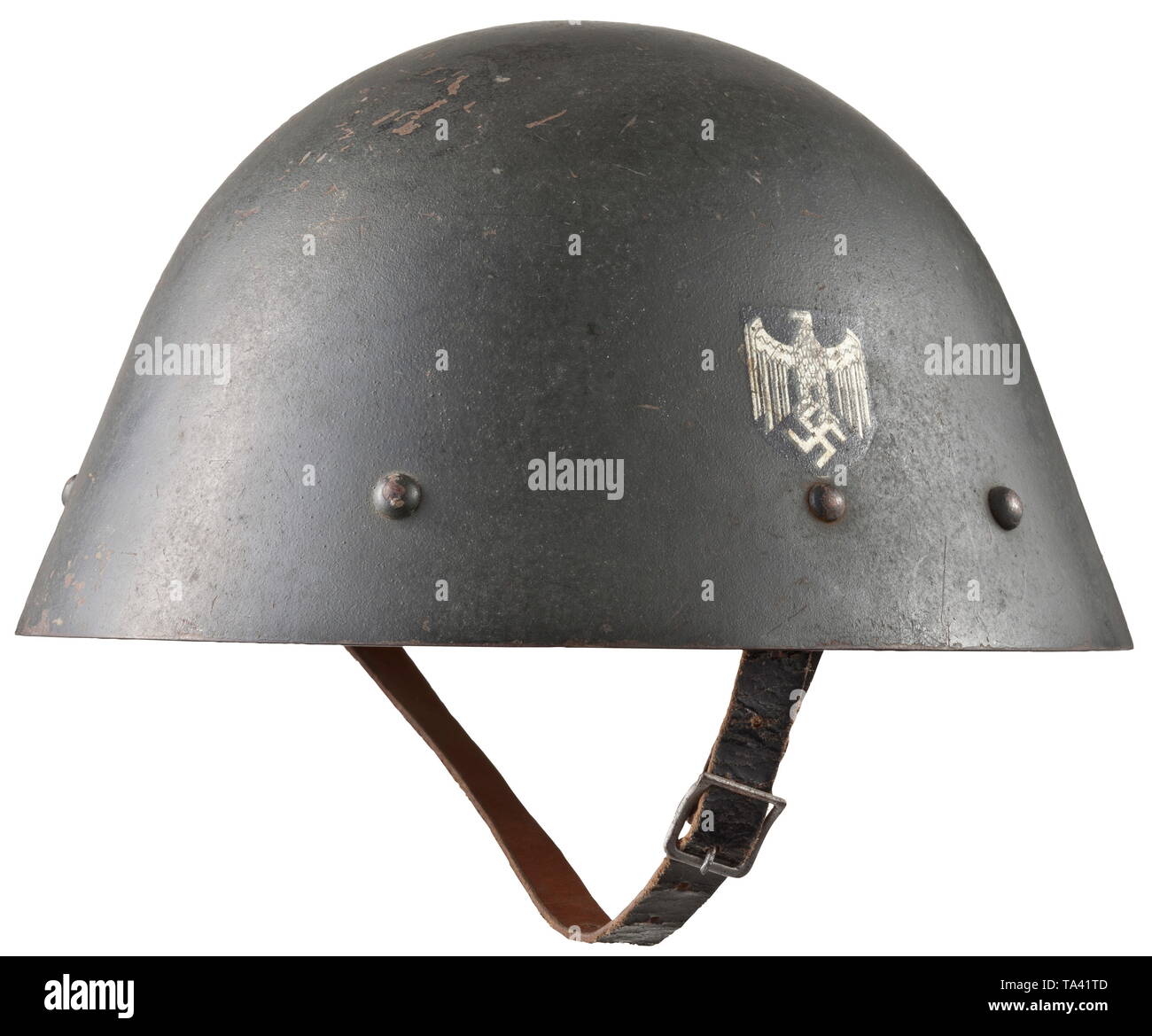 A Slovakian steel helmet M 34 appropriated for Eastern volunteers or Wehrmacht helpers Olivgrün lackierte Stahlglocke , Emblem nahezu vollständig erhalten, vollständiges Innenfutter (ein Polster beschädigt) mit Wehrmachts-Kinnriemen. historic, historical, army, armies, armed forces, military, militaria, object, objects, stills, clipping, clippings, cut out, cut-out, cut-outs, 20th century, Editorial-Use-Only Stock Photo