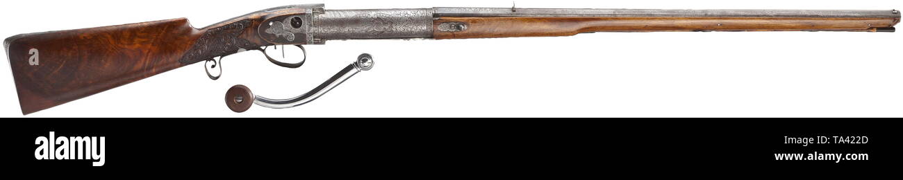 A drop barrel air rifle, A. Sekera, Prague, circa 1860 Octagonal barrel with smooth bore in 7.5 mm calibre with etched Damascus decoration as well as dovetailed front sight and rear sight. On barrel top etched signature 'A. SEKERA IN PRAG'. Release lever for drop barrel in front of fully ornamentally and figurally etched pressure cylinder. Ornamentally etched action case with silver-framed hunter on upper side. Closeable lateral opening on the side for (replaced) cocking crank. Two-piece florally carved walnut stock with en suite etched iron furn, Additional-Rights-Clearance-Info-Not-Available Stock Photo