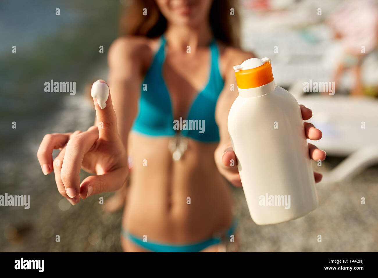 Using sun tan oil hires stock photography and images Alamy