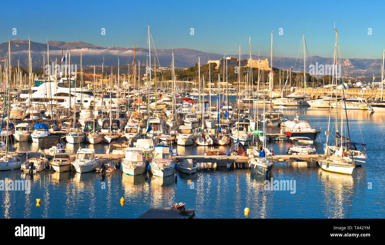 Antibes waterfront and Port Vauban harbor panoramic view, Alps background, Southern France Stock Photo