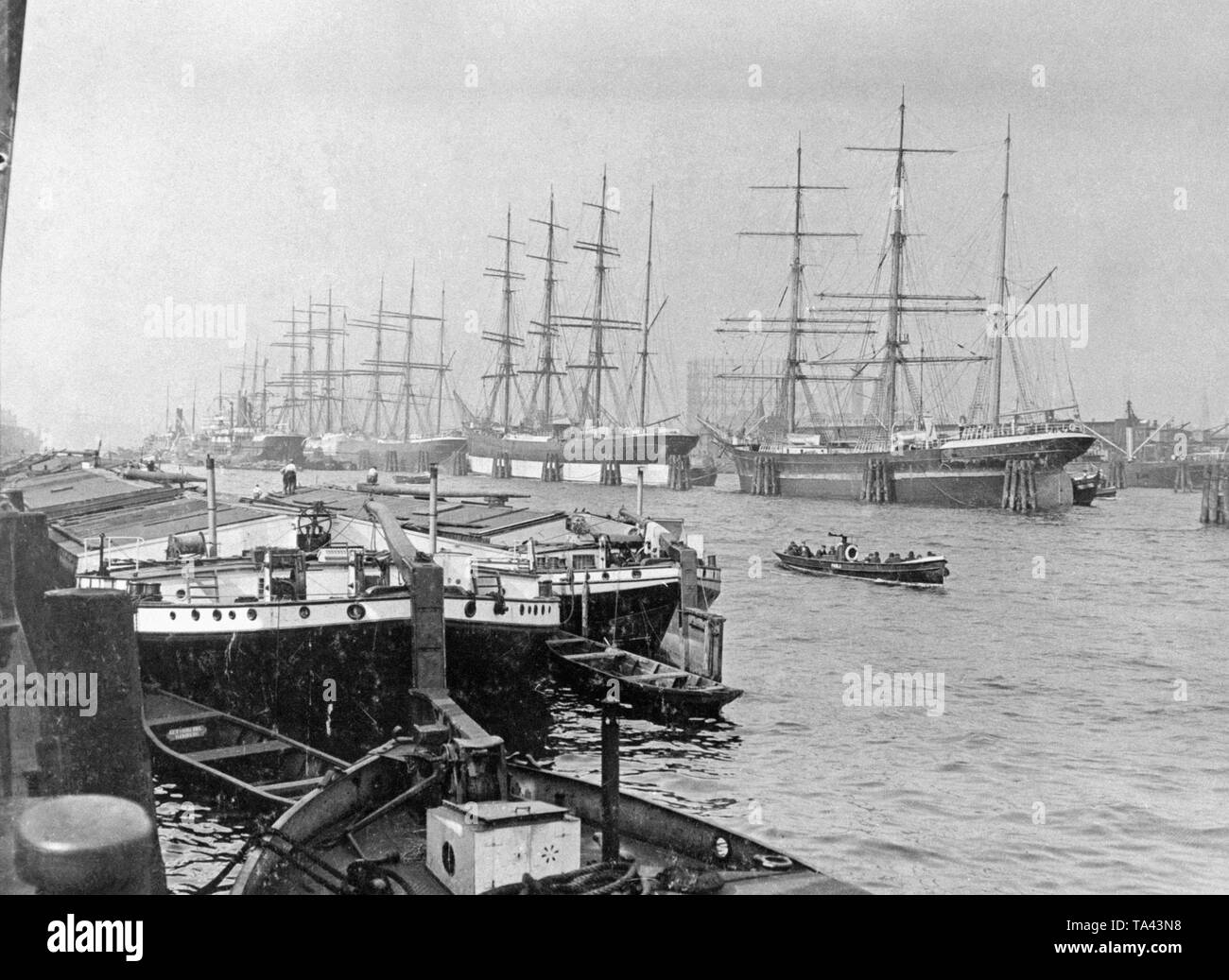 Cargo sailing ships lie in the port of Hamburg. The three, four and