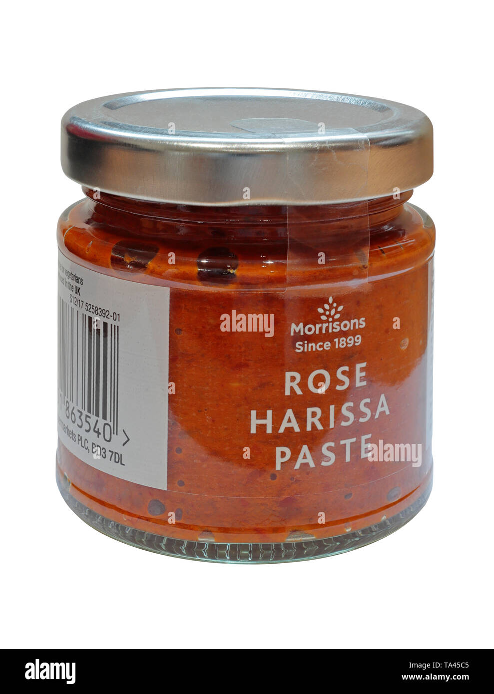 A Jar of Rose Harissa Paste by Morrisons isolated on a white background - Morrisons Since 1899 Stock Photo