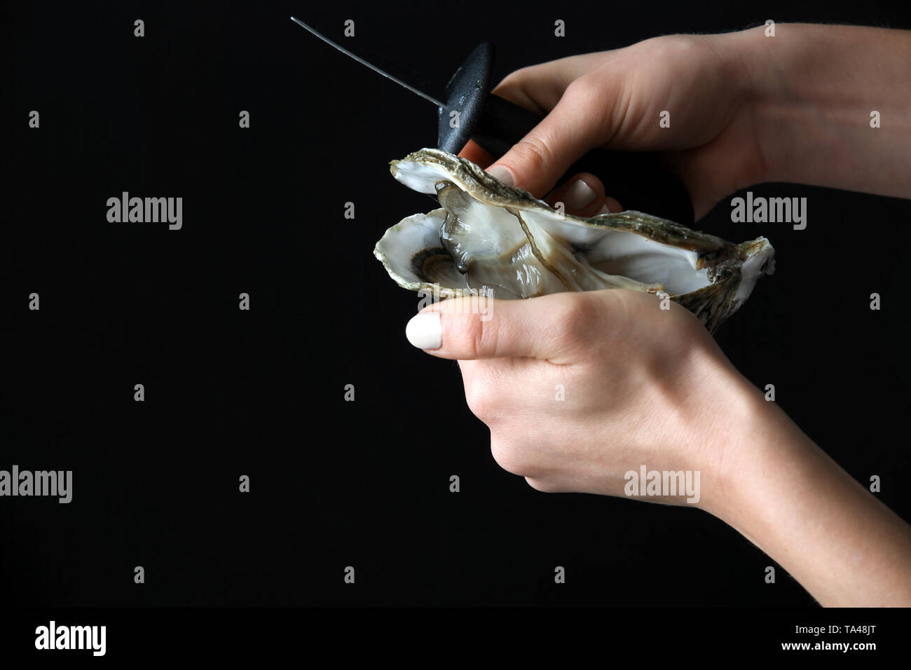 Woman opening oysters hires stock photography and images Alamy