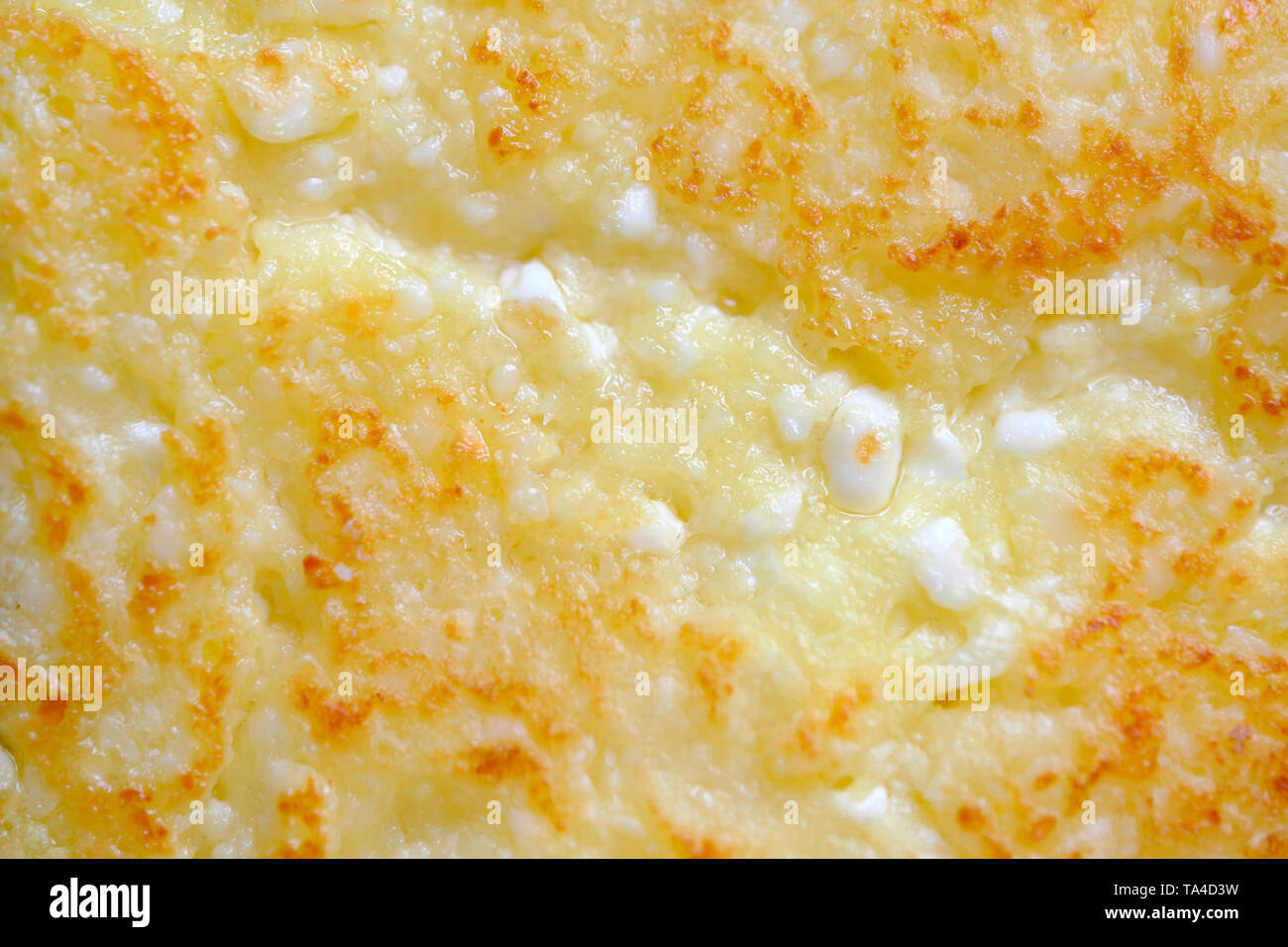 Close-up cheesecakes are cooked in a frying pan with vegetable oil, food background macro photo Stock Photo