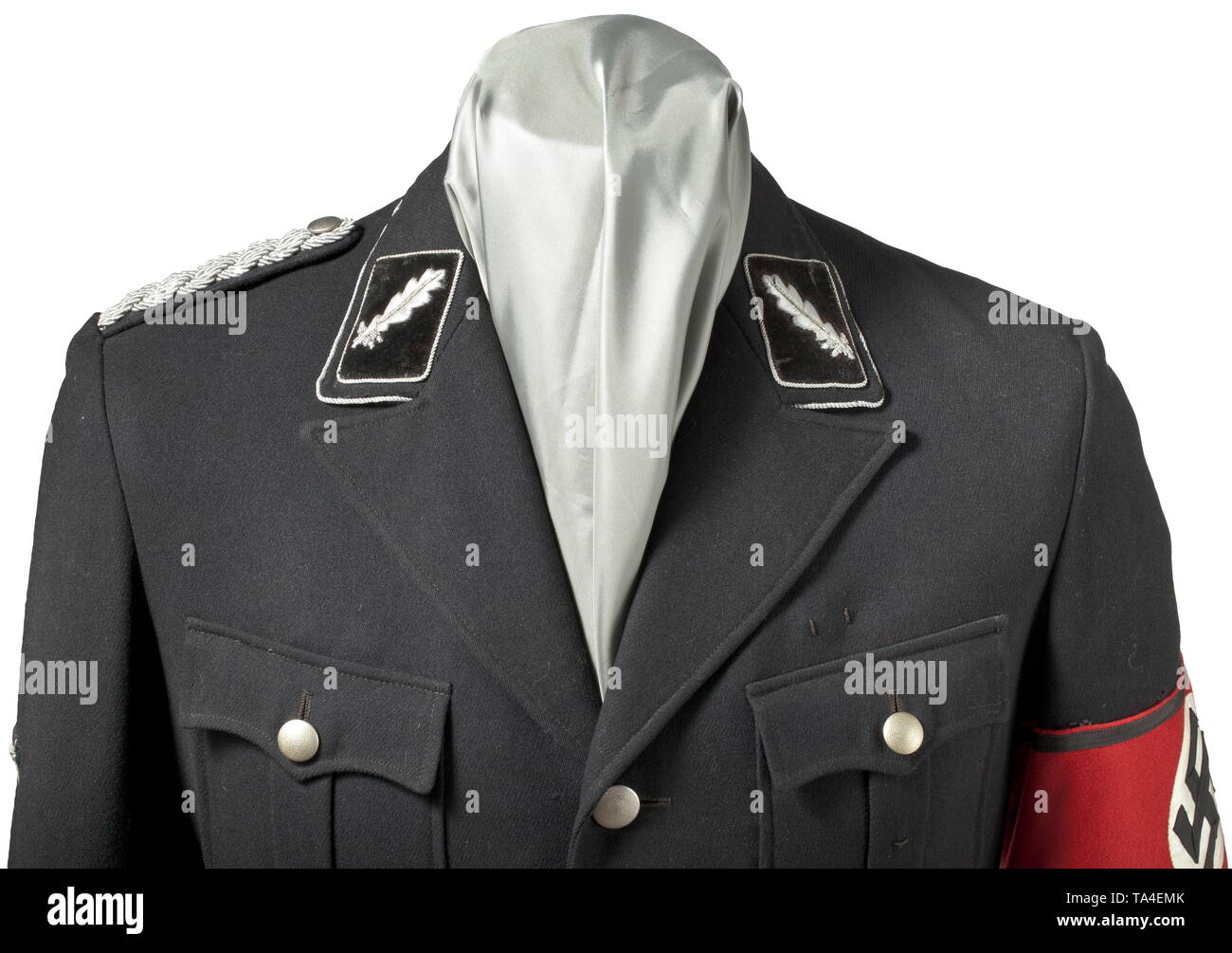 A service uniform for an SS-Standartenführer as an Amtschef (department head) in the Reichsführung-SS depot pieces from the Reichszeugmeisterei Service tunic M 32 made of black garbadine with finely punched RZM buttons, black imitation silk and sewn-on D-ring inside the waist bag to attach chain dagger. Tracks of SS-RZM label on inside pocket. Silver collar cord. Black velvet collar patches with silver-embroidered oak leaves and silver cord trimming. Sewn-on shoulder patch with silver interwoven cords. 'Alte Kämpfer' sleeve chevron with silver-embroidered star for former po, Editorial-Use-Only Stock Photo