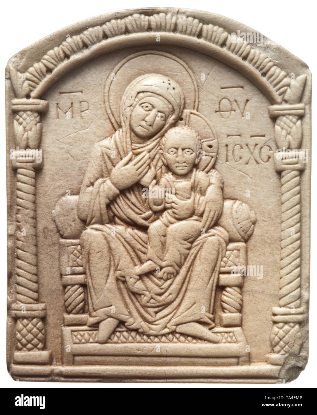 A Middle Byzantine steatite icon with the Virgin Mary, 11th - 12th century Maria Theotokos (God-bearer) represented in the style of Hodegetria. Seated on a throne in a ciborium with the Infant Jesus on her left thigh, Mary is pointing to the Infant Jesus with her right hand. Exceptionally high quality work in exquisite style. Minimal spalling on the edge, otherwise in outstanding condition. Height 6.3 cm. Provenance: Viennese private collection, acquired in the art trade during the 1990s. historic, historical, middle ages, Additional-Rights-Clearance-Info-Not-Available Stock Photo