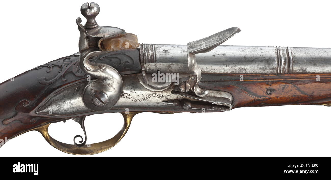 A pair of flintlock pistols, P. Knust, Mürau (Mirov), Moravia/CZ, circa 1730 Round and smooth two-stage barrels in 13.5 mm calibre with brass front sights. Lightly cut flintlocks, on both lockplates engraved signatures 'P. KNUST A MIROW'. Carved walnut stocks with horn nosepieces (both butts broken and adhered, one forearm with crack). Gilded, finely engraved brass furnitures, on both side plates engraved monogram 'J.C.V.Z.' Original wooden ramrods with horn tips. Length 36.5 cm each. P. Knust, Mürau, circa 1710-20. High-quality workmanship. Pist, Additional-Rights-Clearance-Info-Not-Available Stock Photo