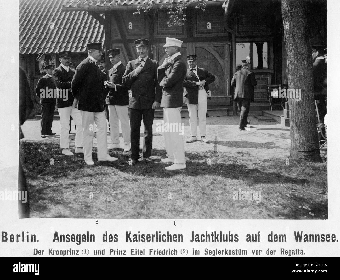 Prince Eitel Friedrich (2) and his older brother Crown Prince Wilhelm (1) on the shores of the Wannsee before the start of the regatta . Between the two is probably their brother Prince August Wilhelm. Stock Photo