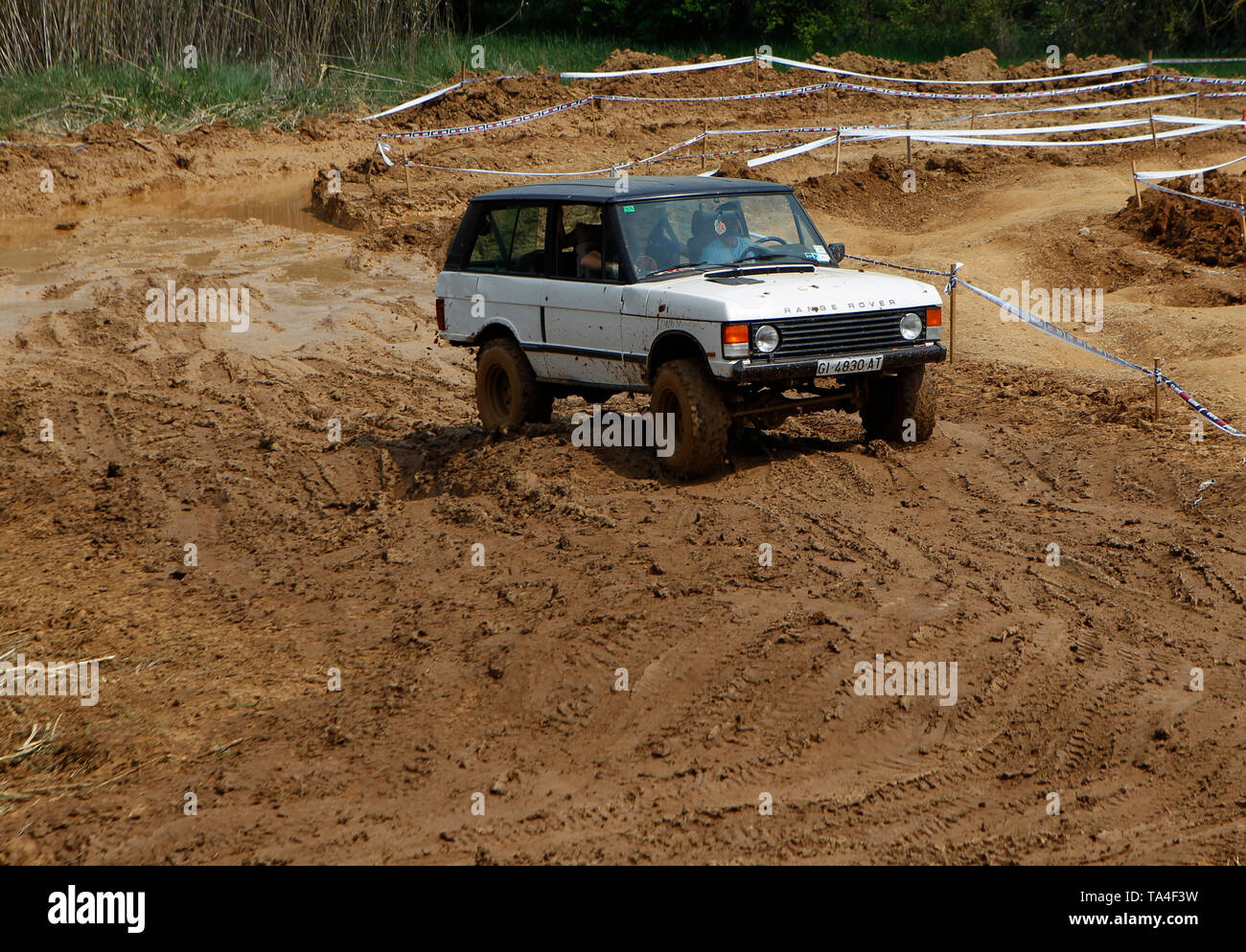 Four wheel drive cars tackling a mud circuit in Spain Stock Photo Alamy